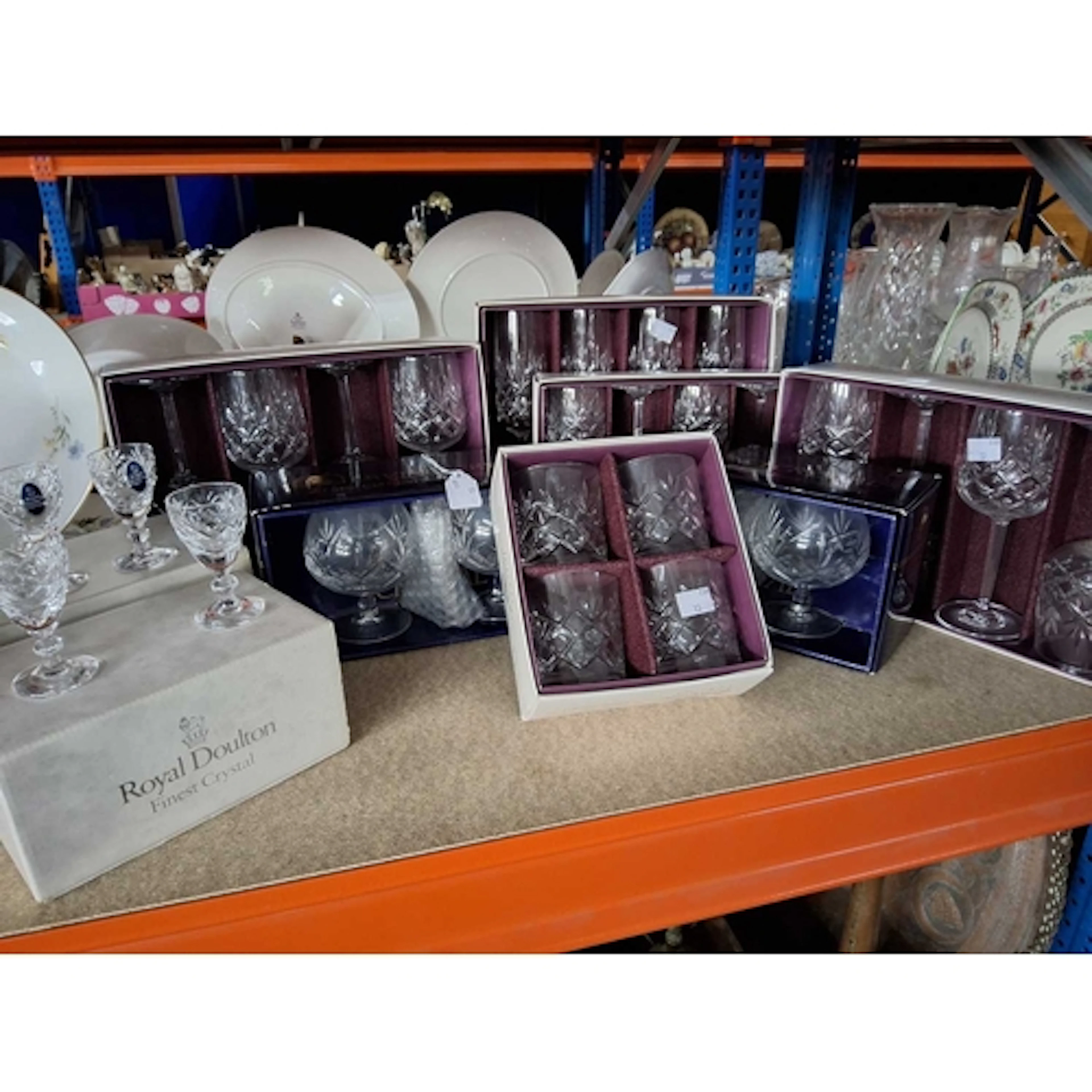 A GROUP OF BOXED CRYSTAL DRINKING VESSELS, comprising four V...