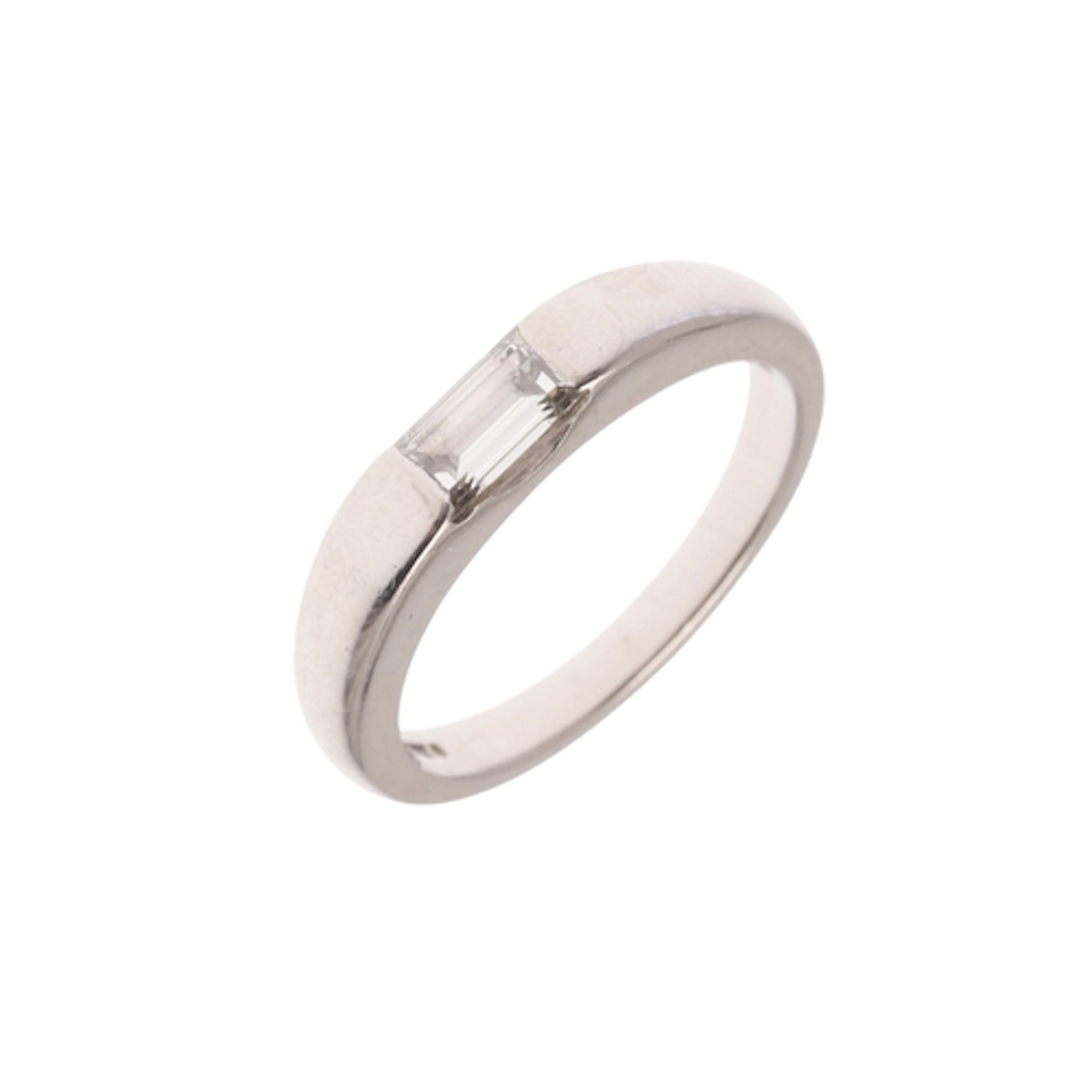 A DIAMOND AND PLATINUM RING. the platinum band is set with a...