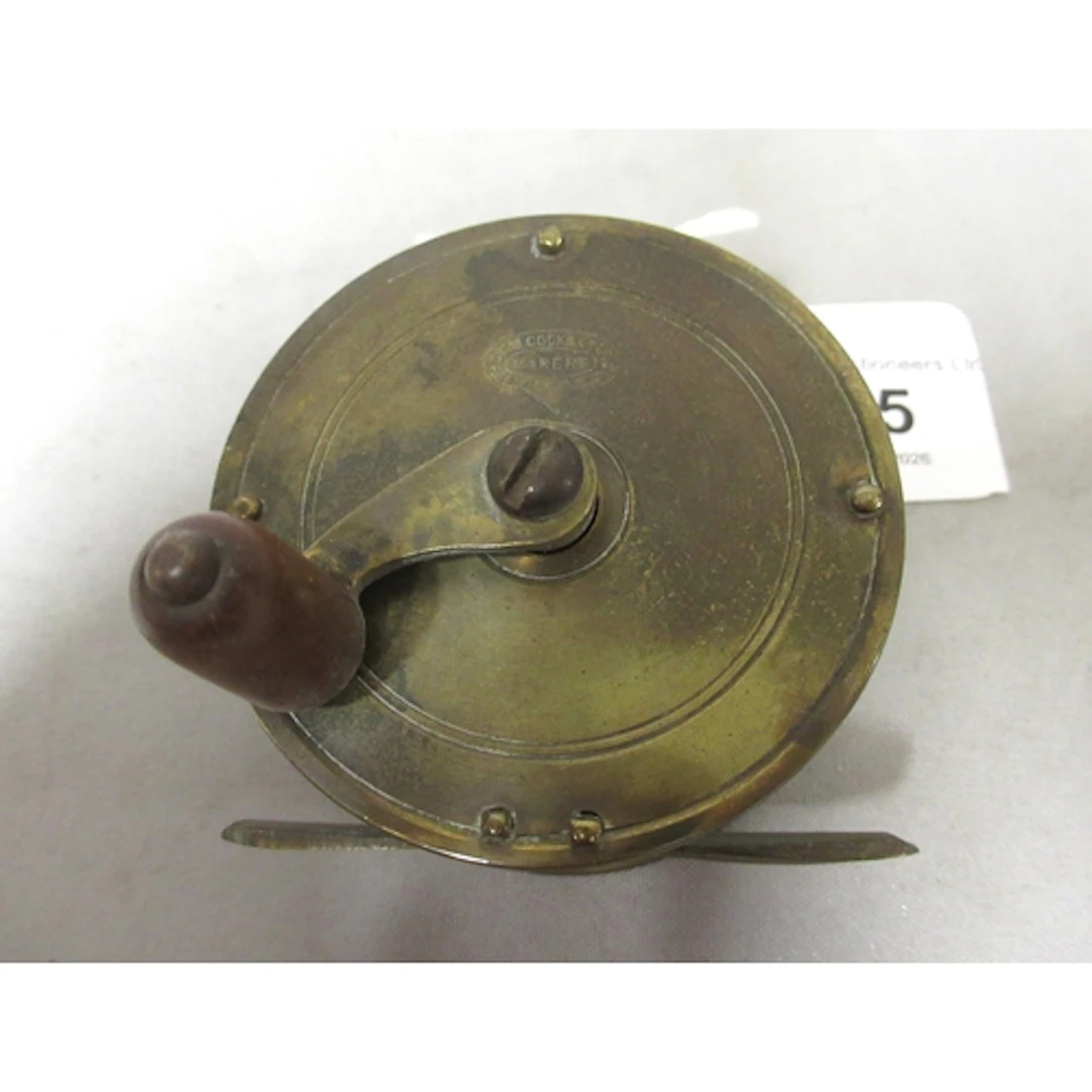 Small Allcock and Co brass centre pin reel, 2 1/4" diameter