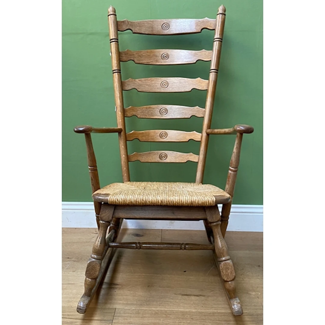 A large ladderback rocking chair, 20th century, 62cmW