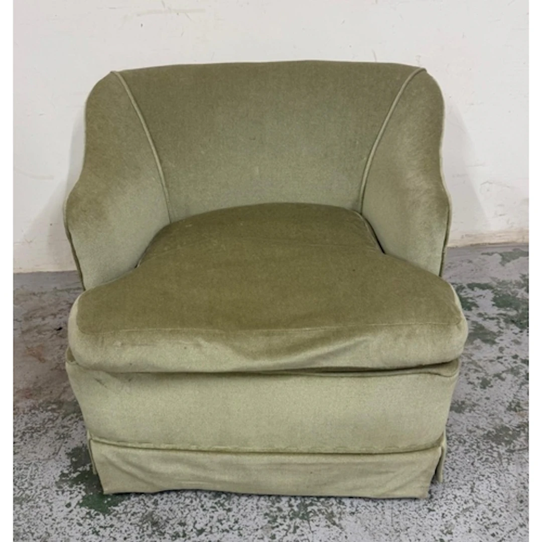 A green velvet bedroom chair