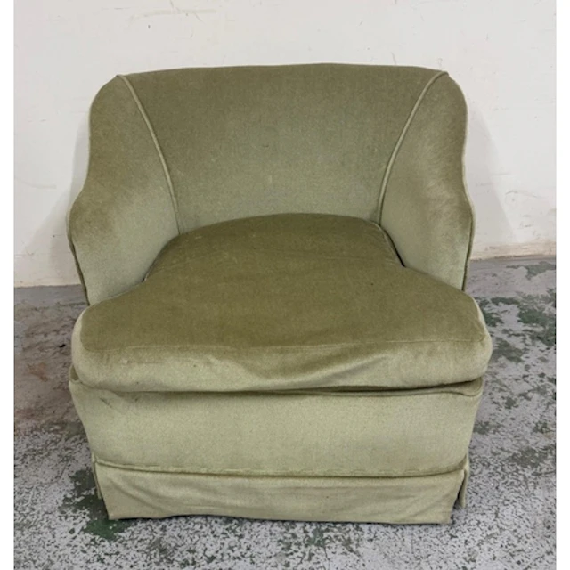 A green velvet bedroom chair