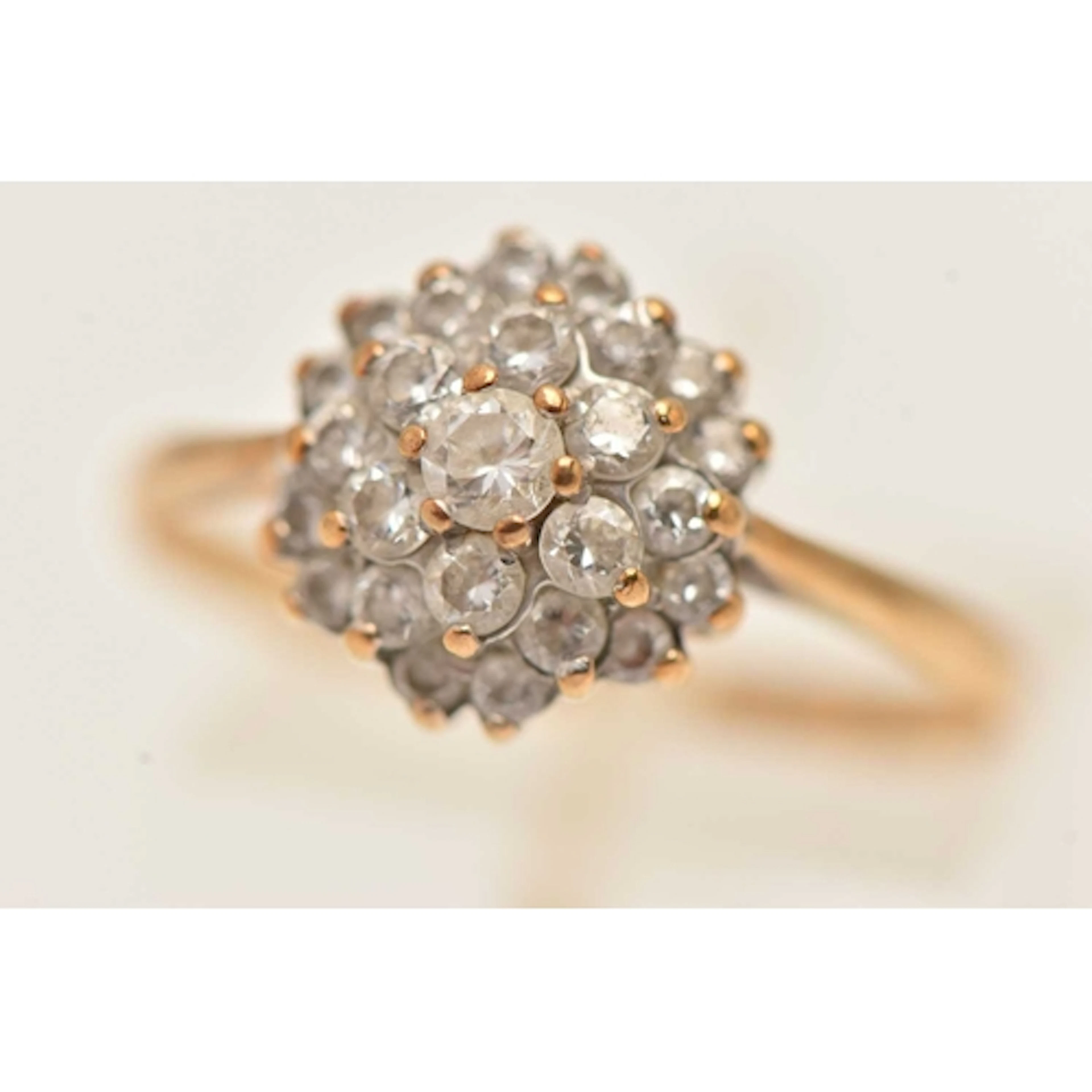 A 9CT GOLD CUBIC ZIRCONIA CLUSTER RING, tiered cluster, with...