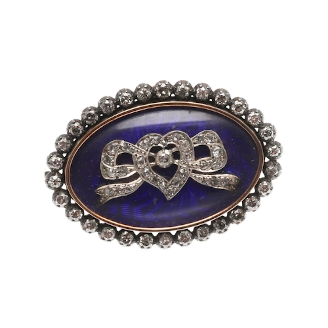 A GEORGIAN DIAMOND AND ENAMEL BROOCH. of oval-shape, centred...