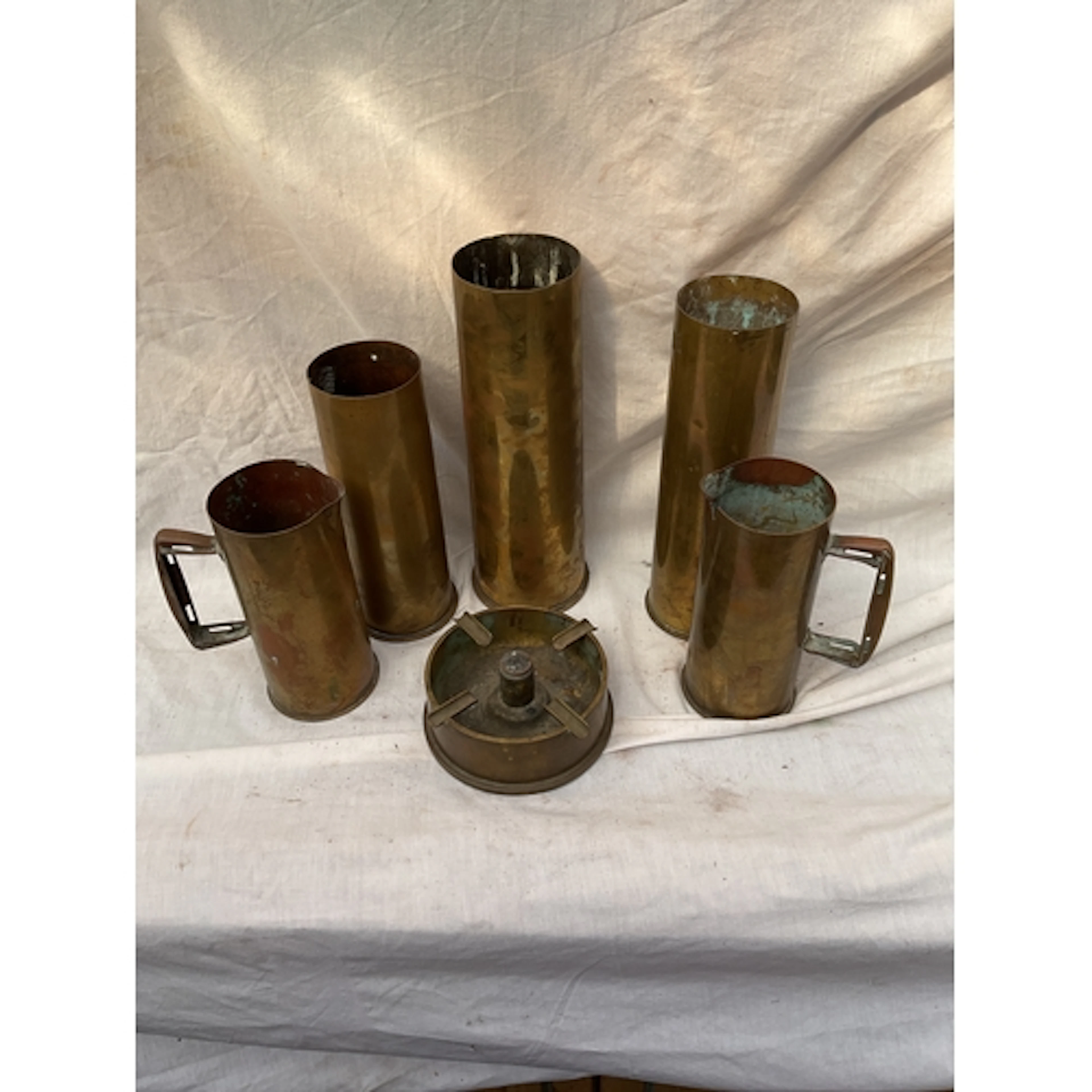 Trench art jugs, ashtray and artillery shells.