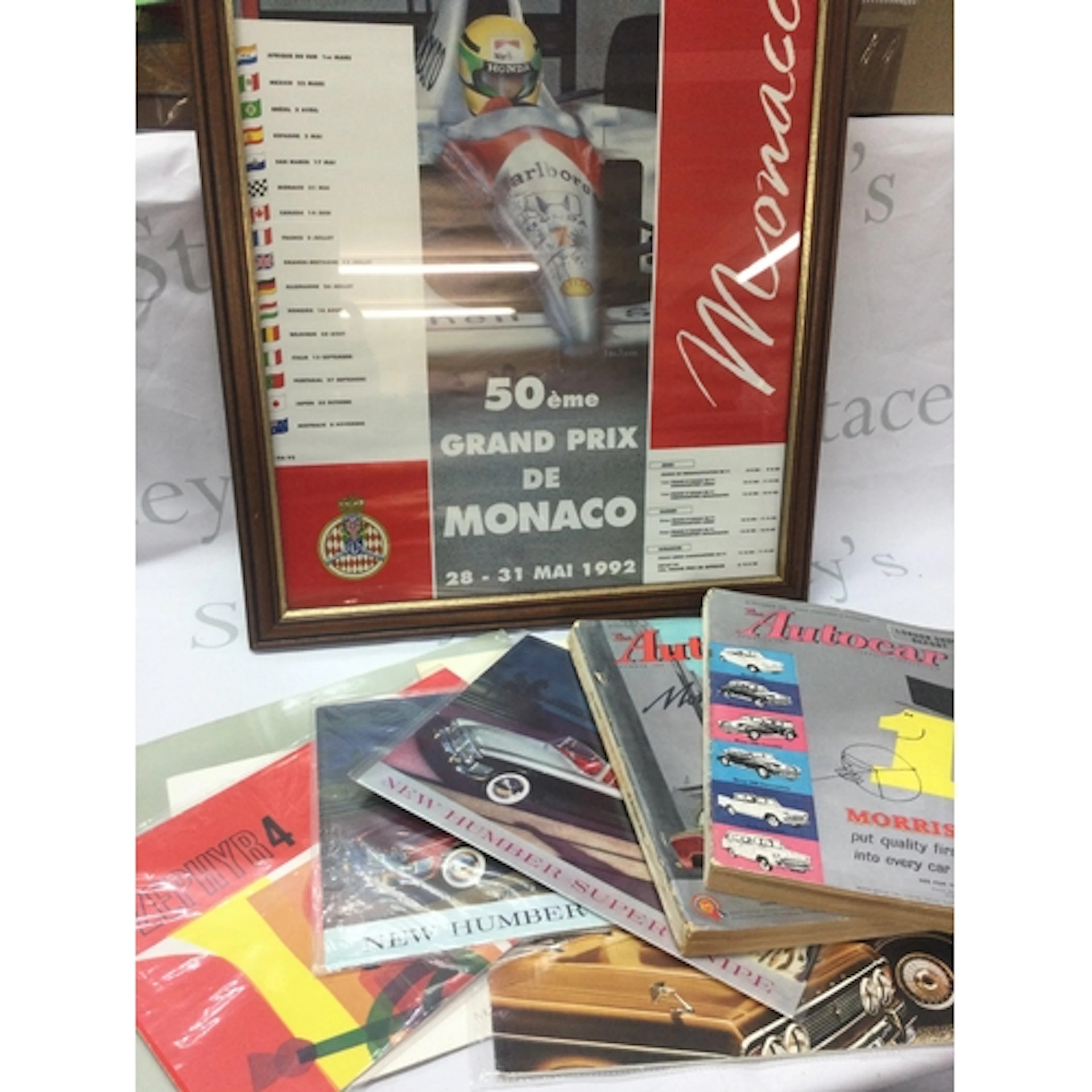 A collection of vintage motoring items including a framed Fo...
