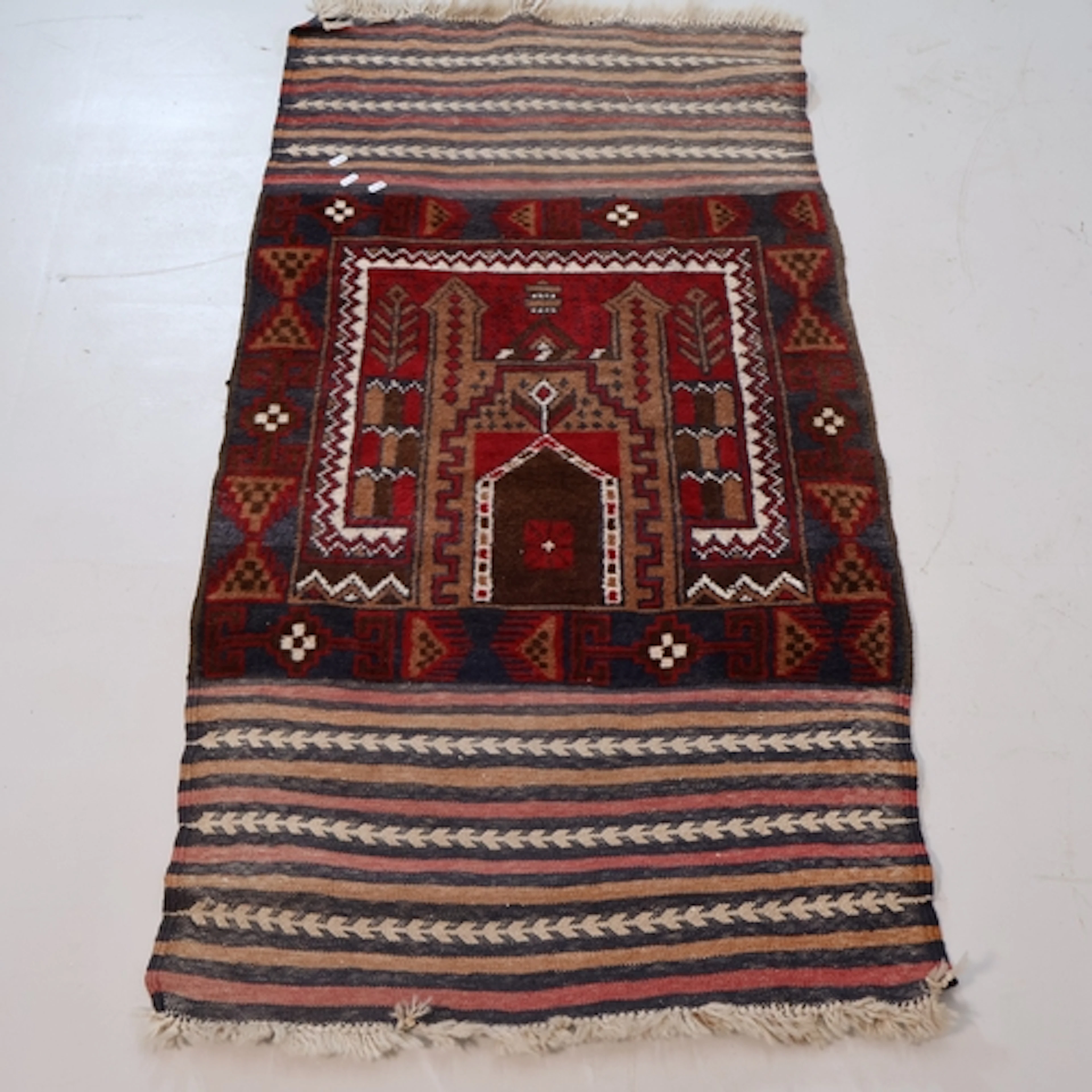An antique Afghan saddlebag, converted to a prayer rug, L144...