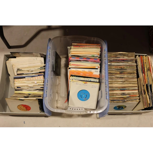 Three boxes of mixed 7'' singles.