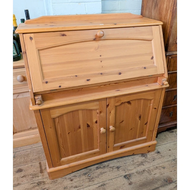 A modern pine bureau with cupboards under, 3' wide