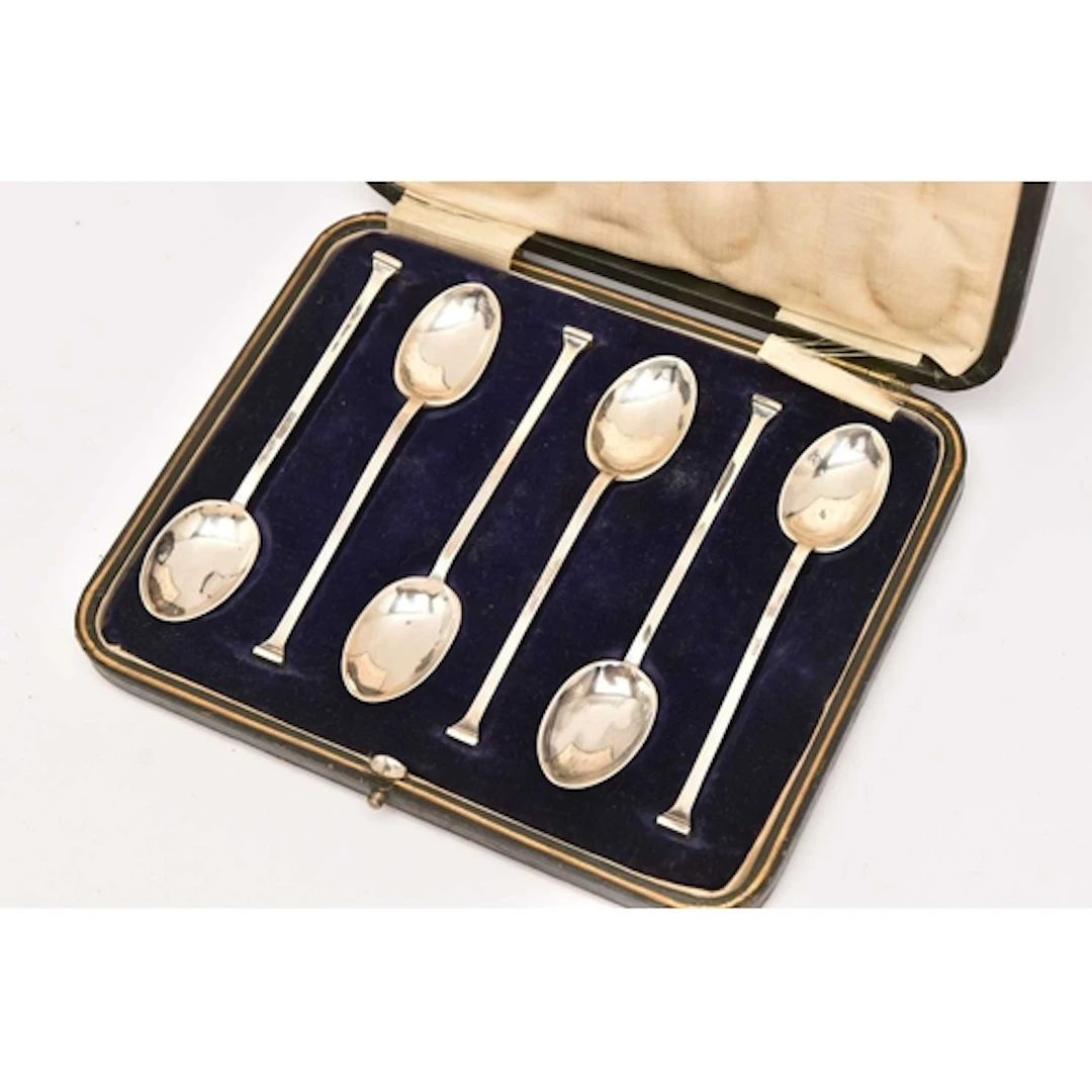 A CASED SET OF TEASPOONS, six spoons with colum handles, hal...