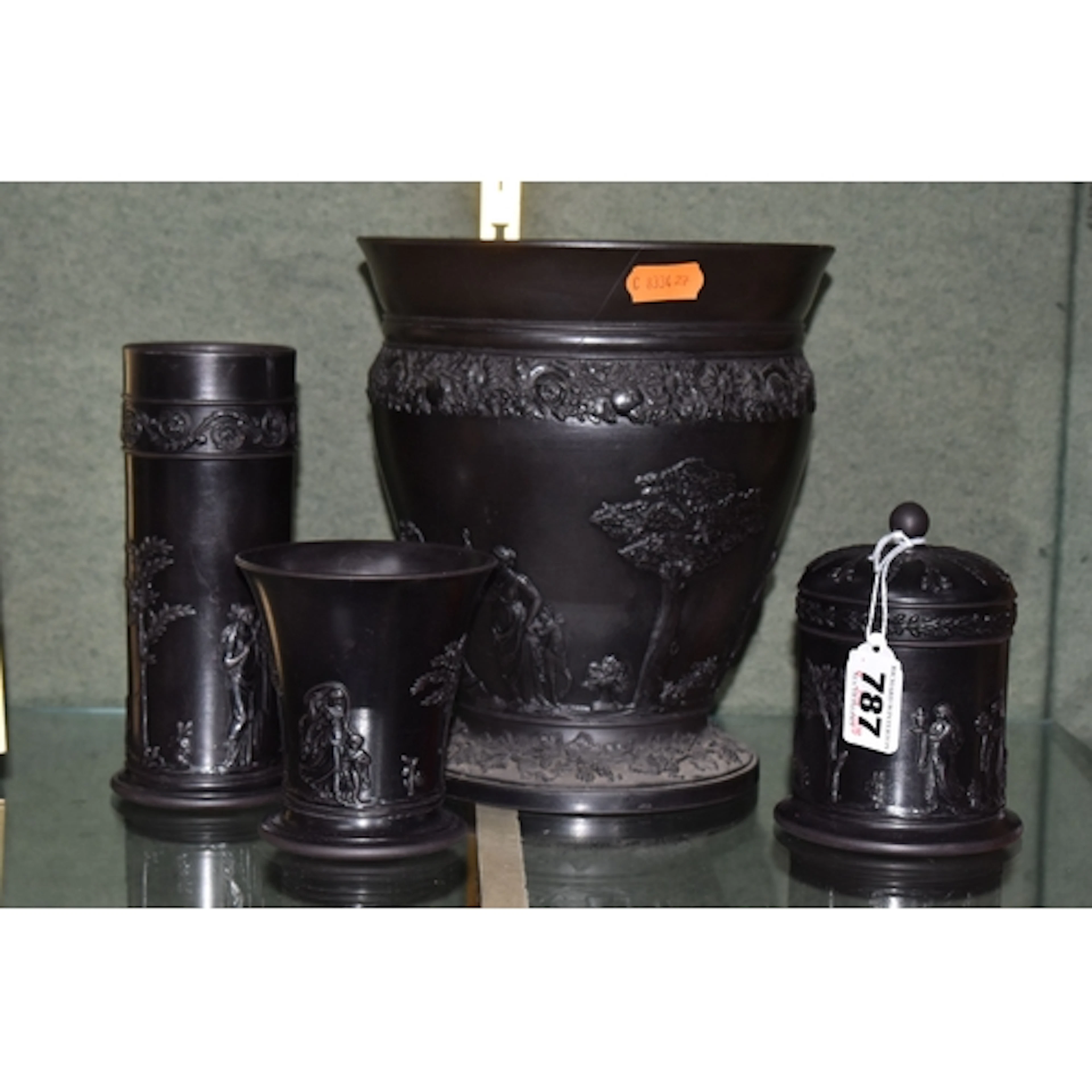 FOUR PIECES OF WEDGWOOD BLACK BASALT, comprising a footed ba...