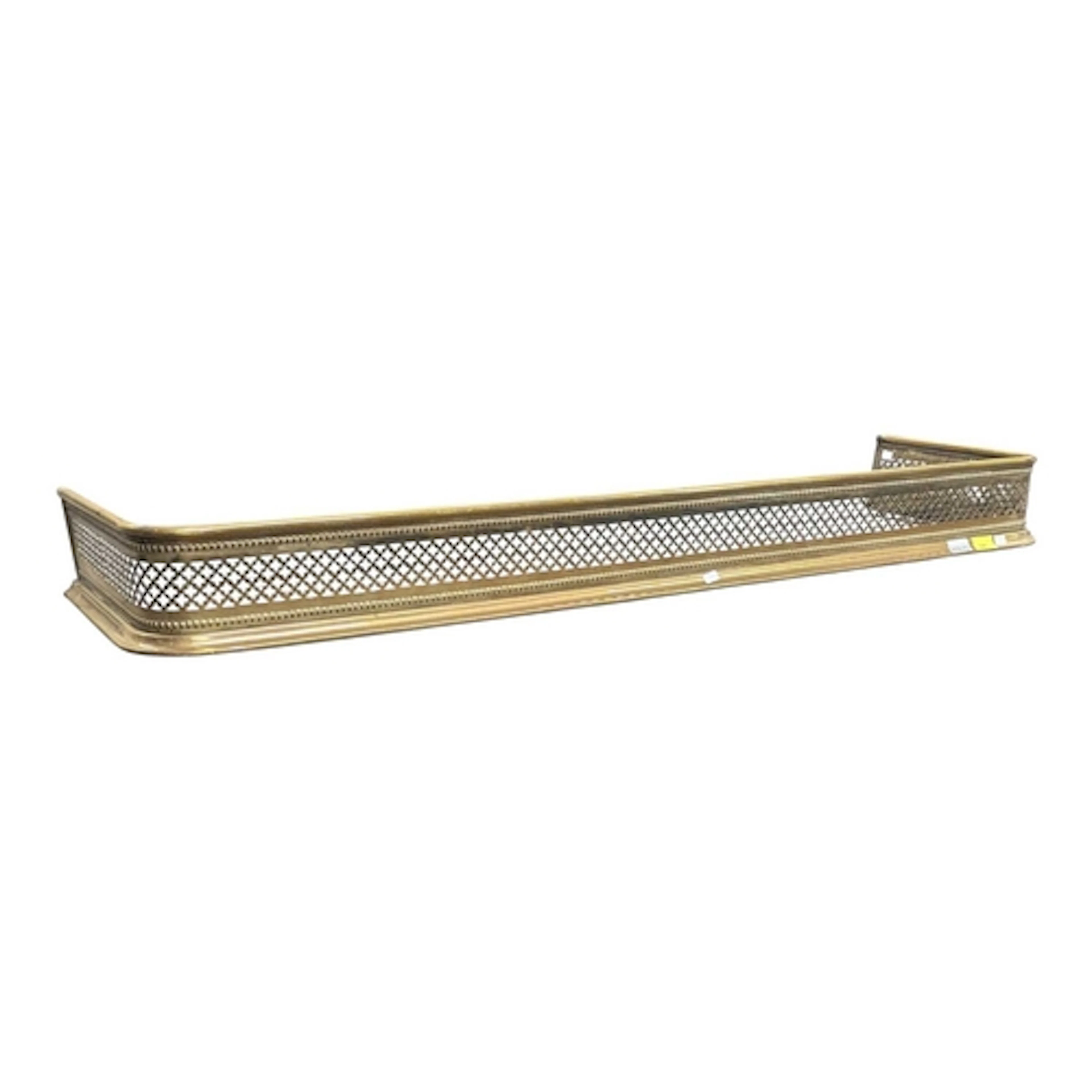 An early 20th century polished brass-worked fire fender. The...
