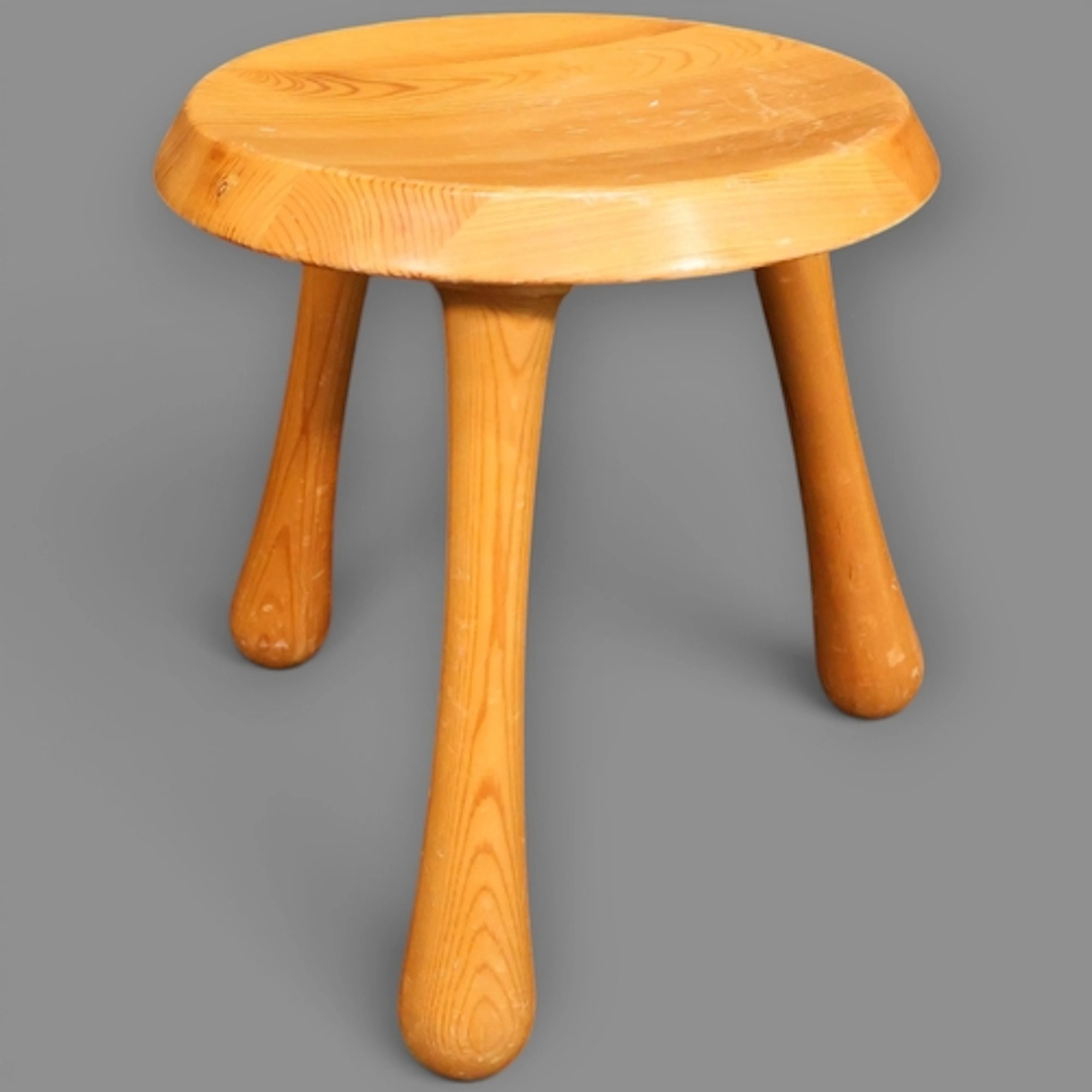 A contemporary lacquered pine milking stool by Ingvar Kampra...