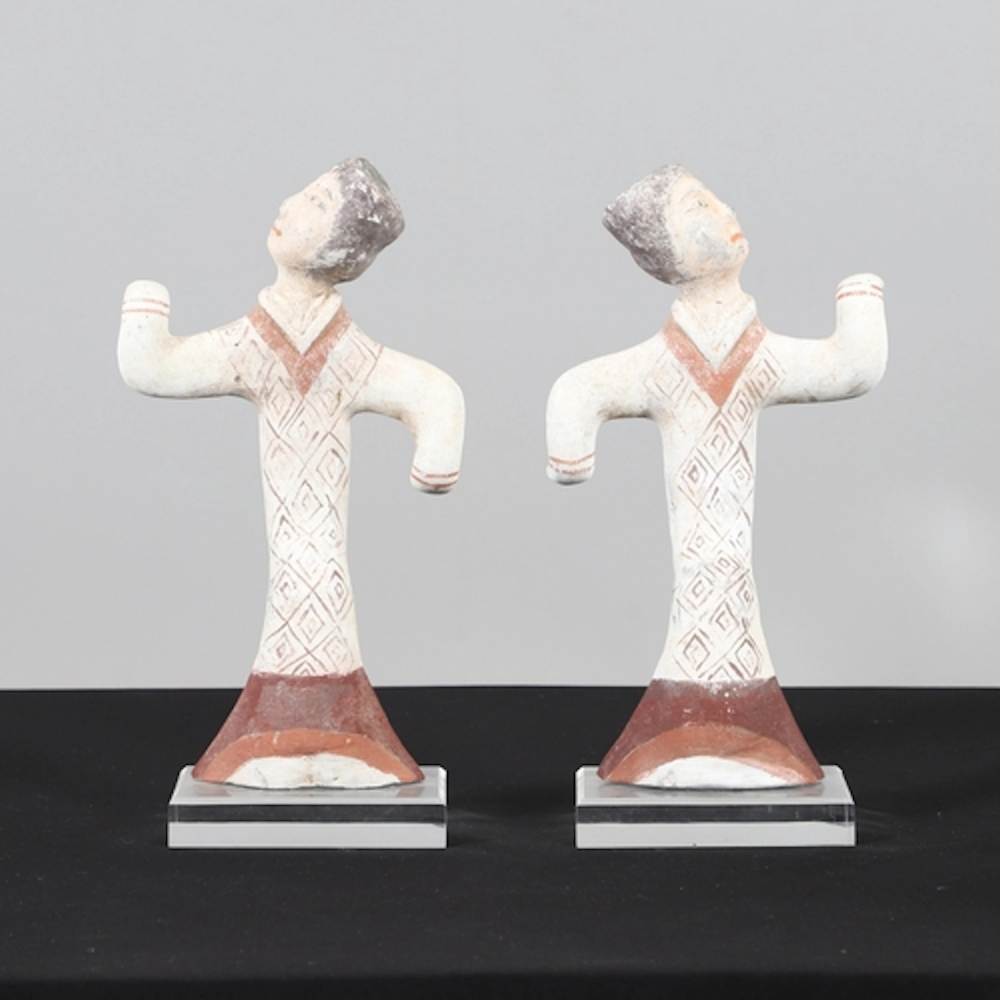 PAIR OF CHINESE PAINTED FIGURES - HAN DYNASTY. A pair of Chi...