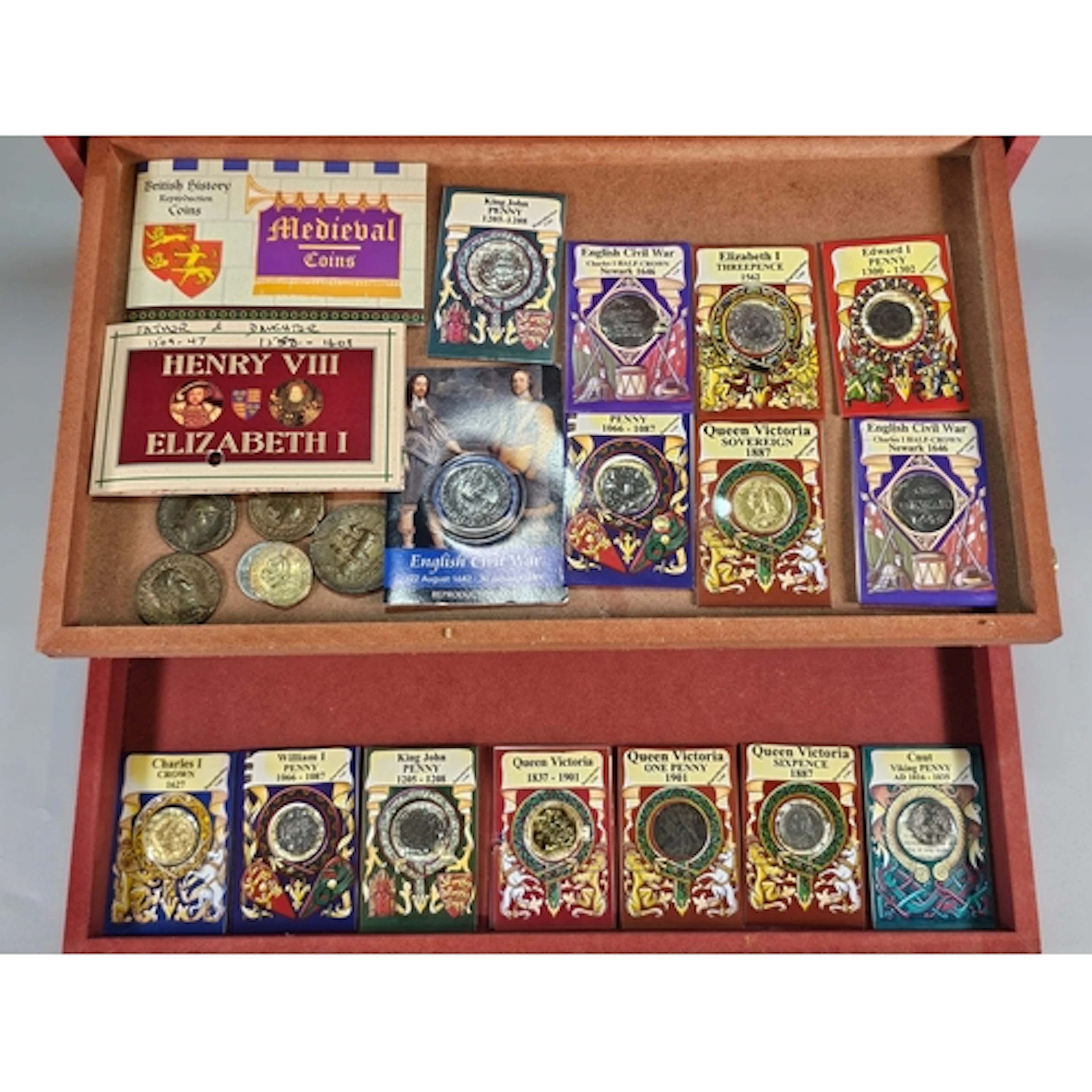 Four wooden coin cases comprising assorted coins including: ...