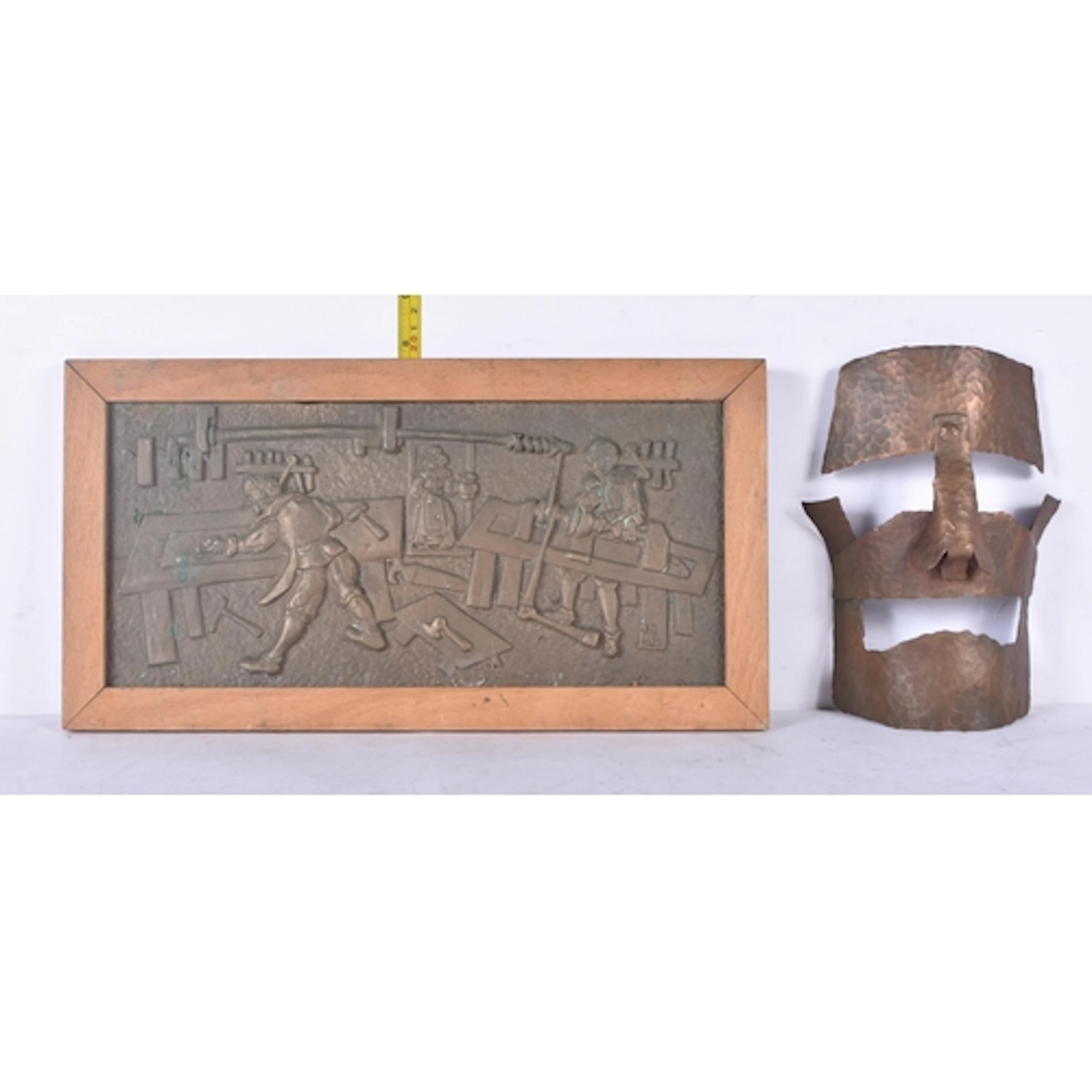 A copper face mask sculpture together with a heavy brass pan...