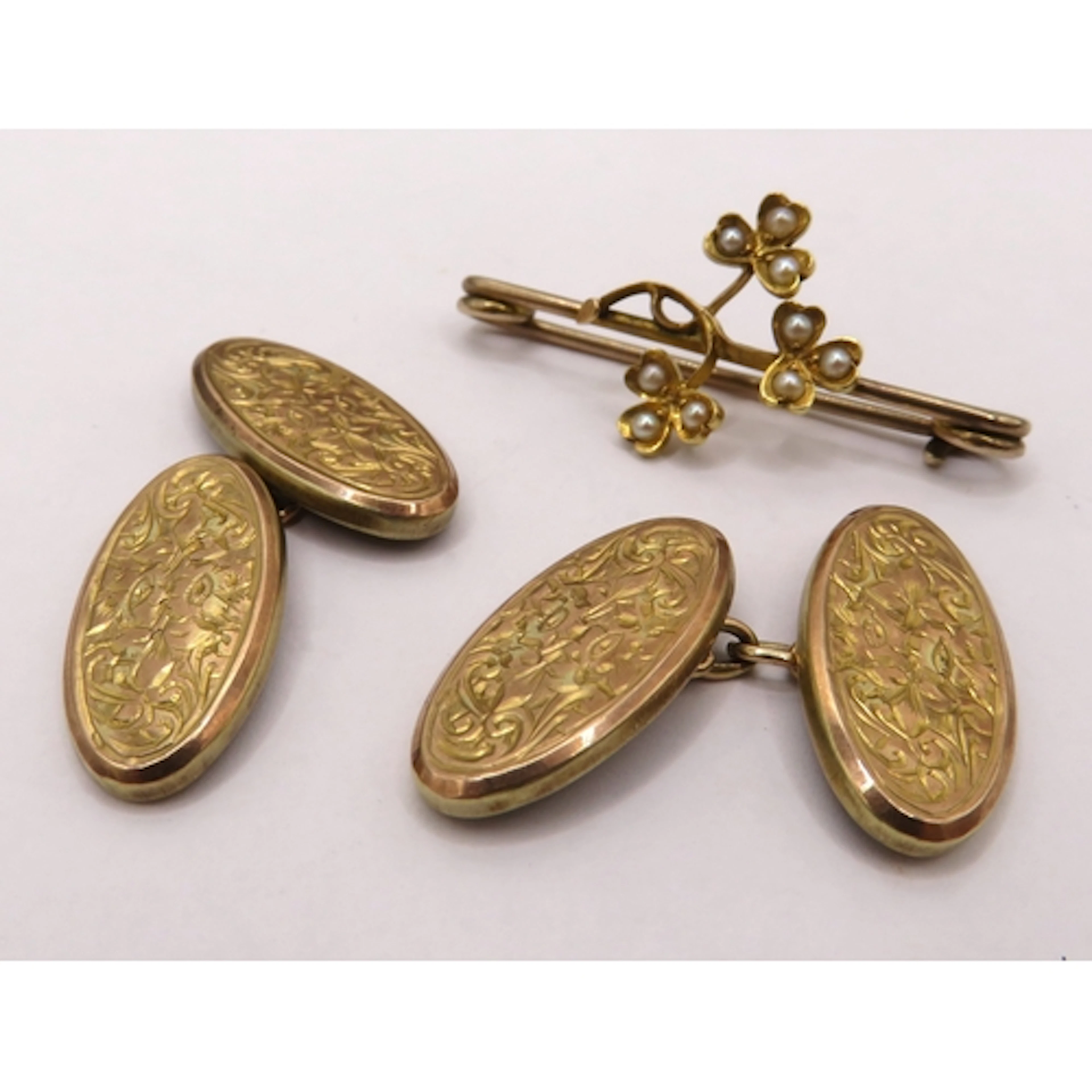Pair of 9ct gold oval cufflinks, 3.2g, together with a yello...