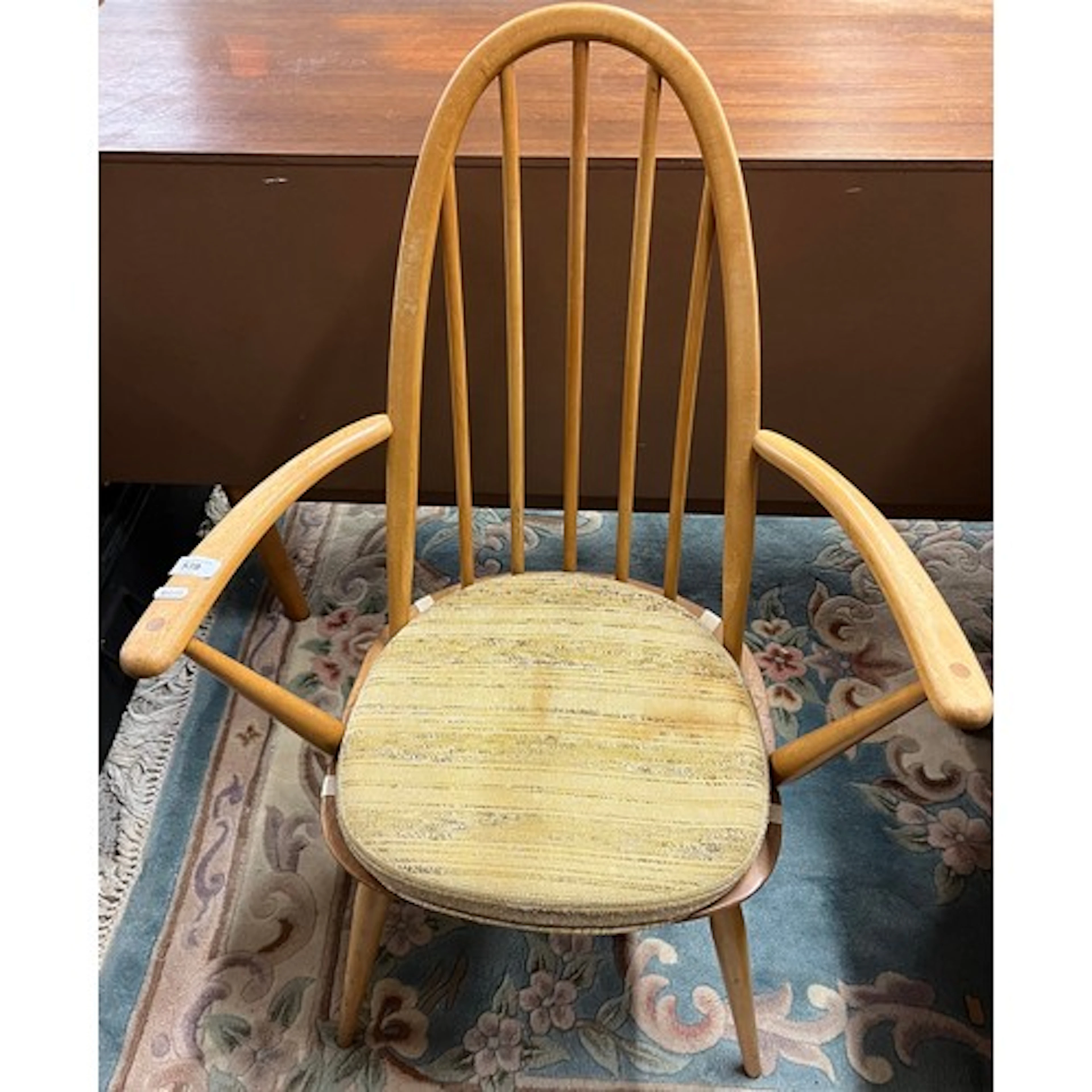 Ercol blonde open armchair.