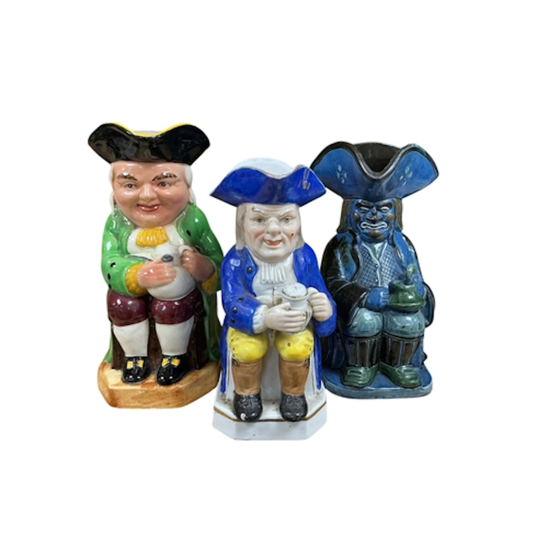 Three Toby jugs to include a musical example and one by C H ...
