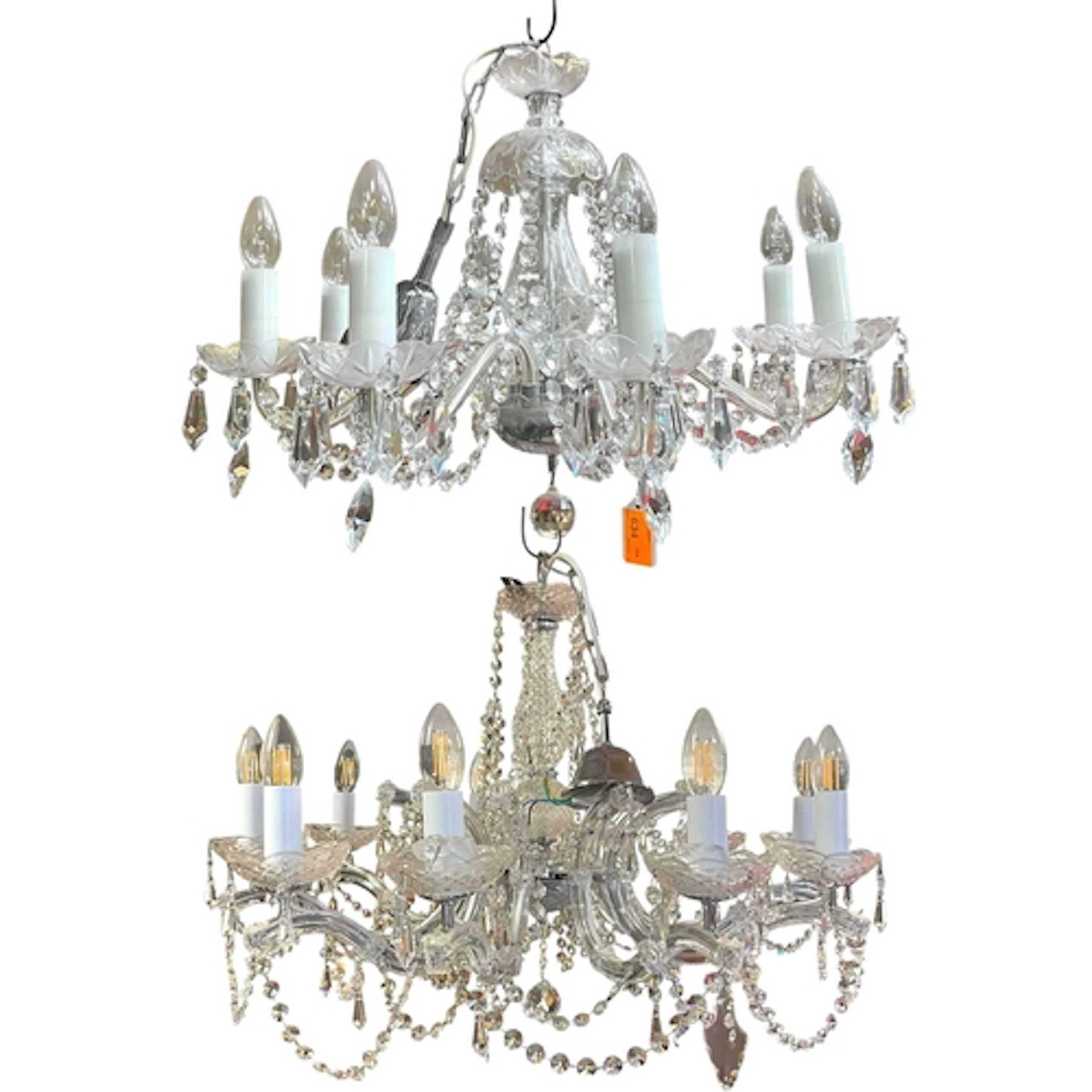 A near pair of 8-arm classical glass chandeliers. The ornate...