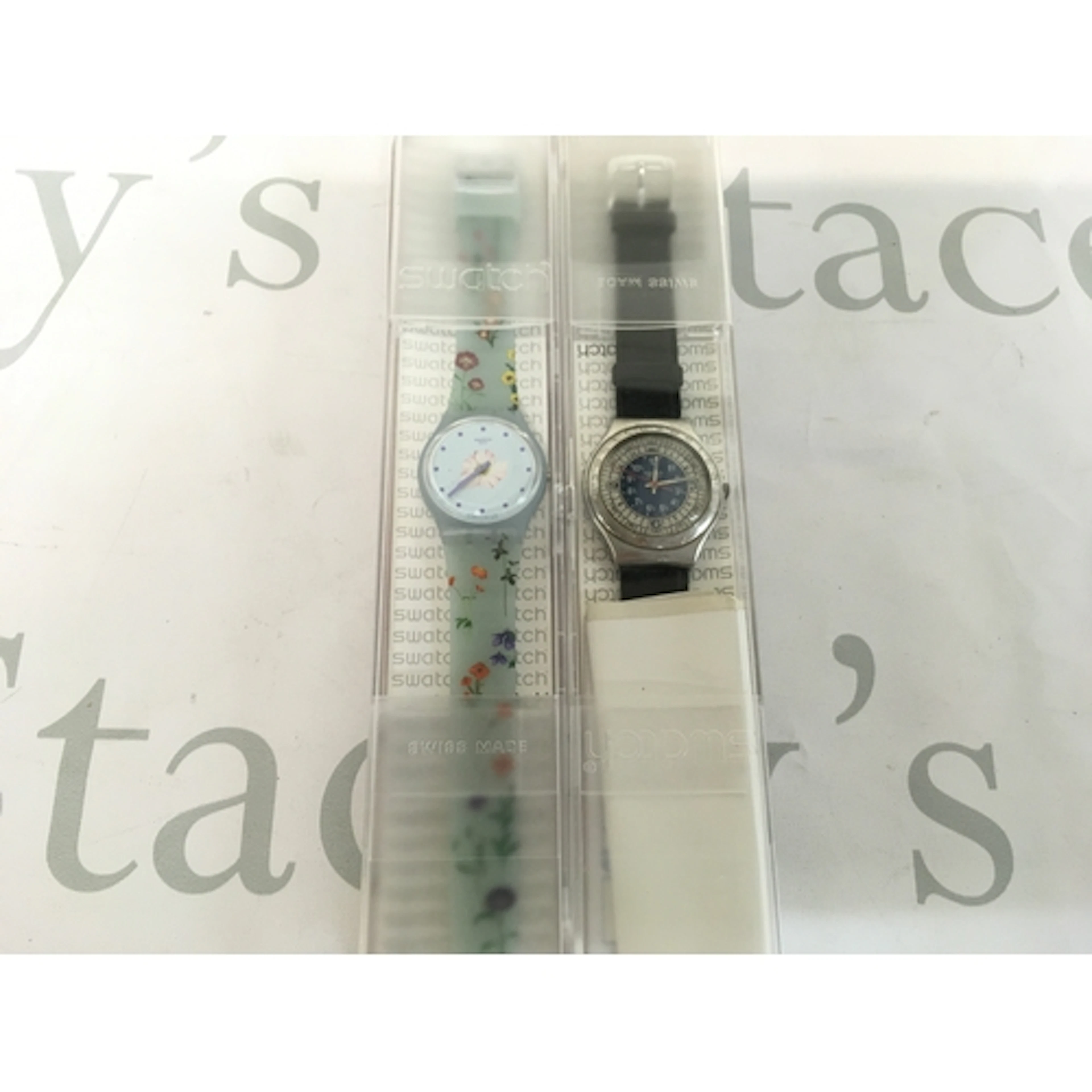 Swatch Pistillo (GS152) features a light blue floral dial an...