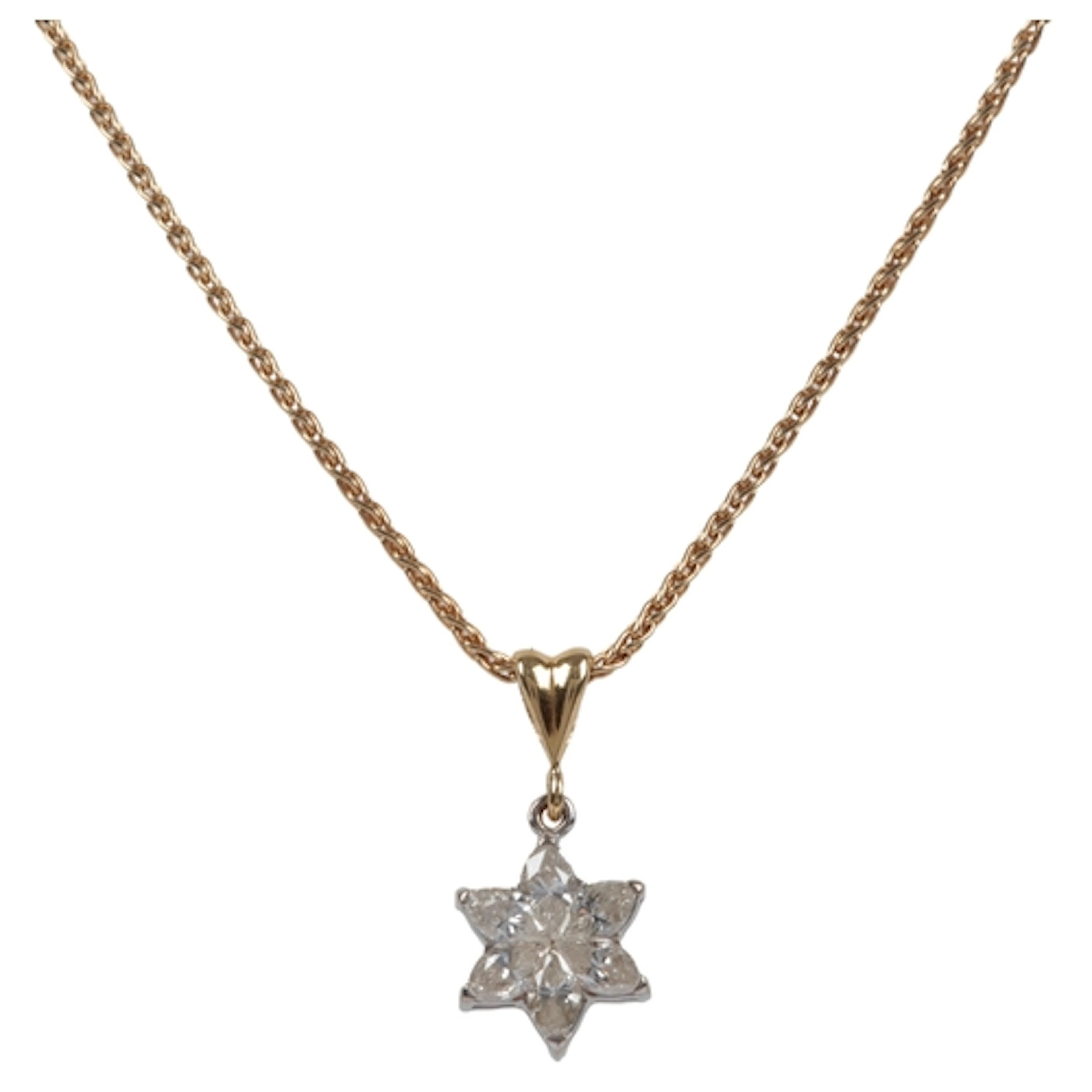 A diamond cluster pendant, set with marquise-shaped diamonds...