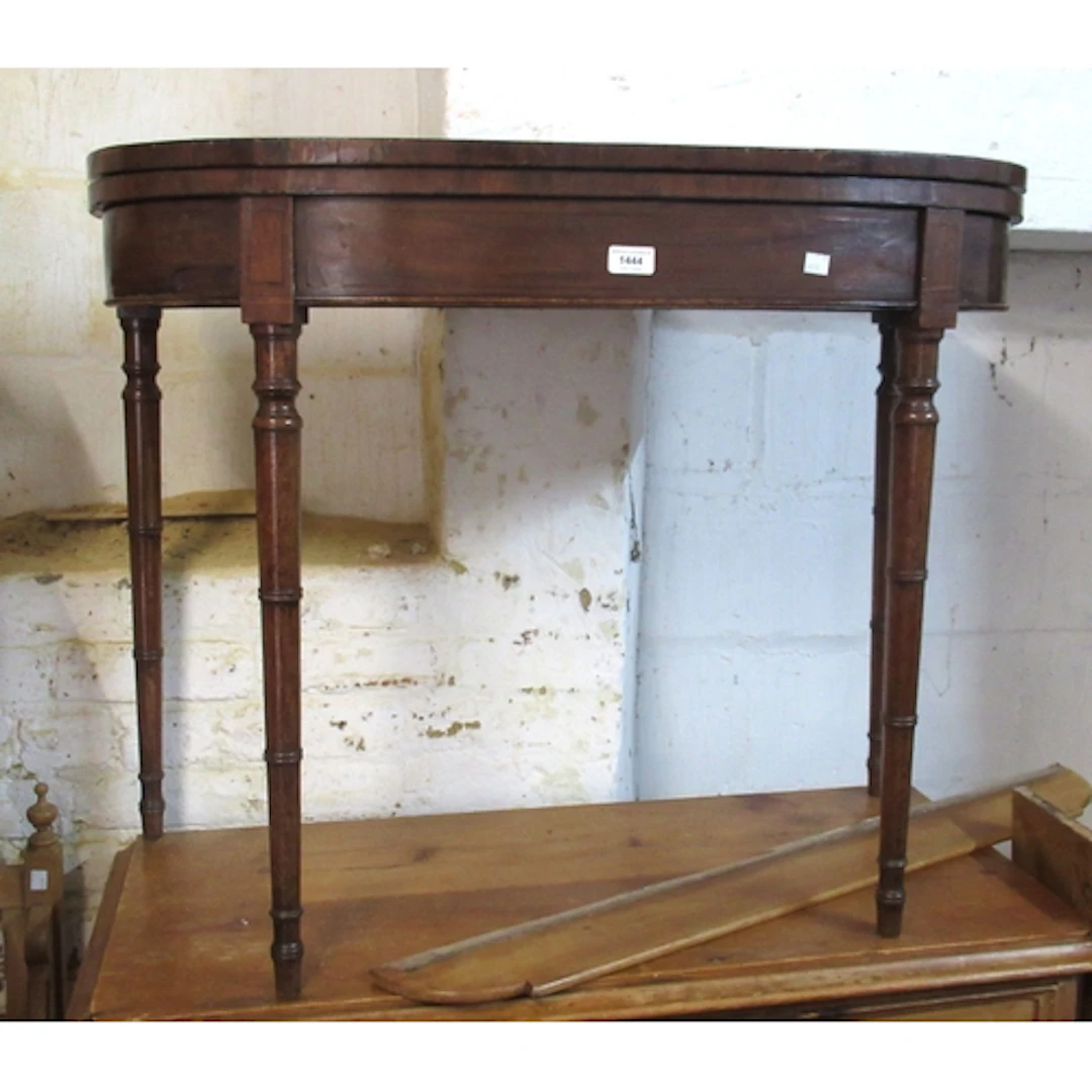 George III mahogany D-shaped fold over card table, raised on...