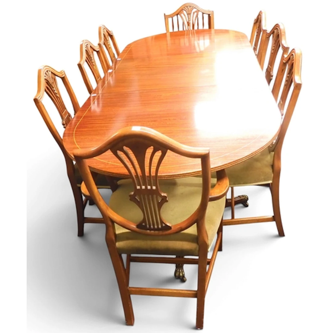 A 20th century mahogany reproduction dining suite consisting...