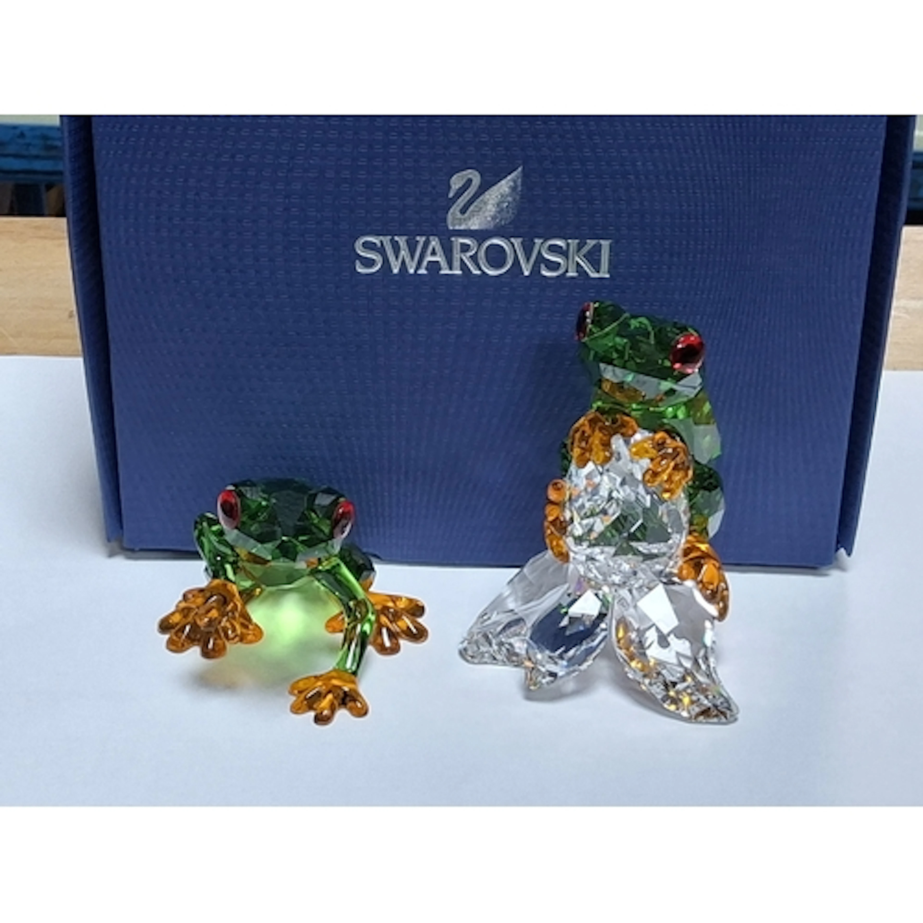 A PAIR OF SWAROVSKI CRYSTAL PARADISE FROGS SCULPTURES, model...