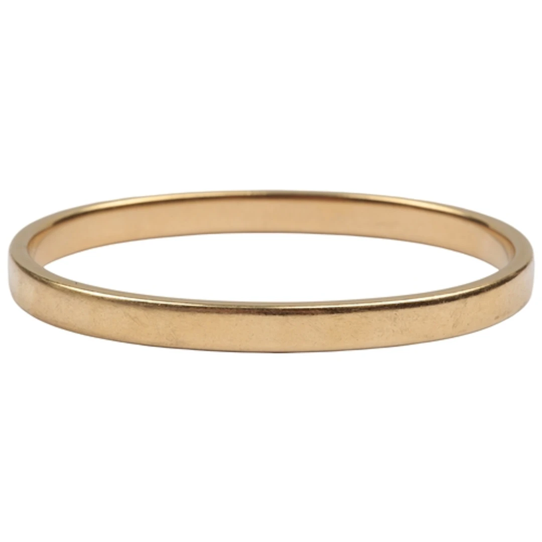 A gold bangle, late 19th/early 20th century, designed as a c...