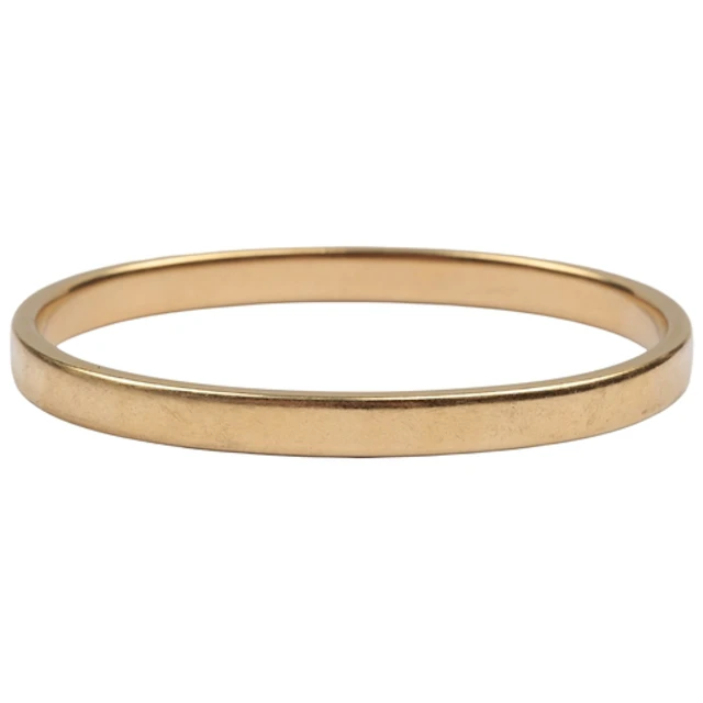 A gold bangle, late 19th/early 20th century, designed as a c...