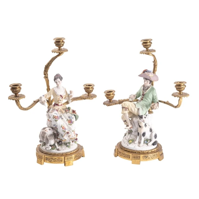 A pair of Continental gilt bronze and porcelain mounted figu...