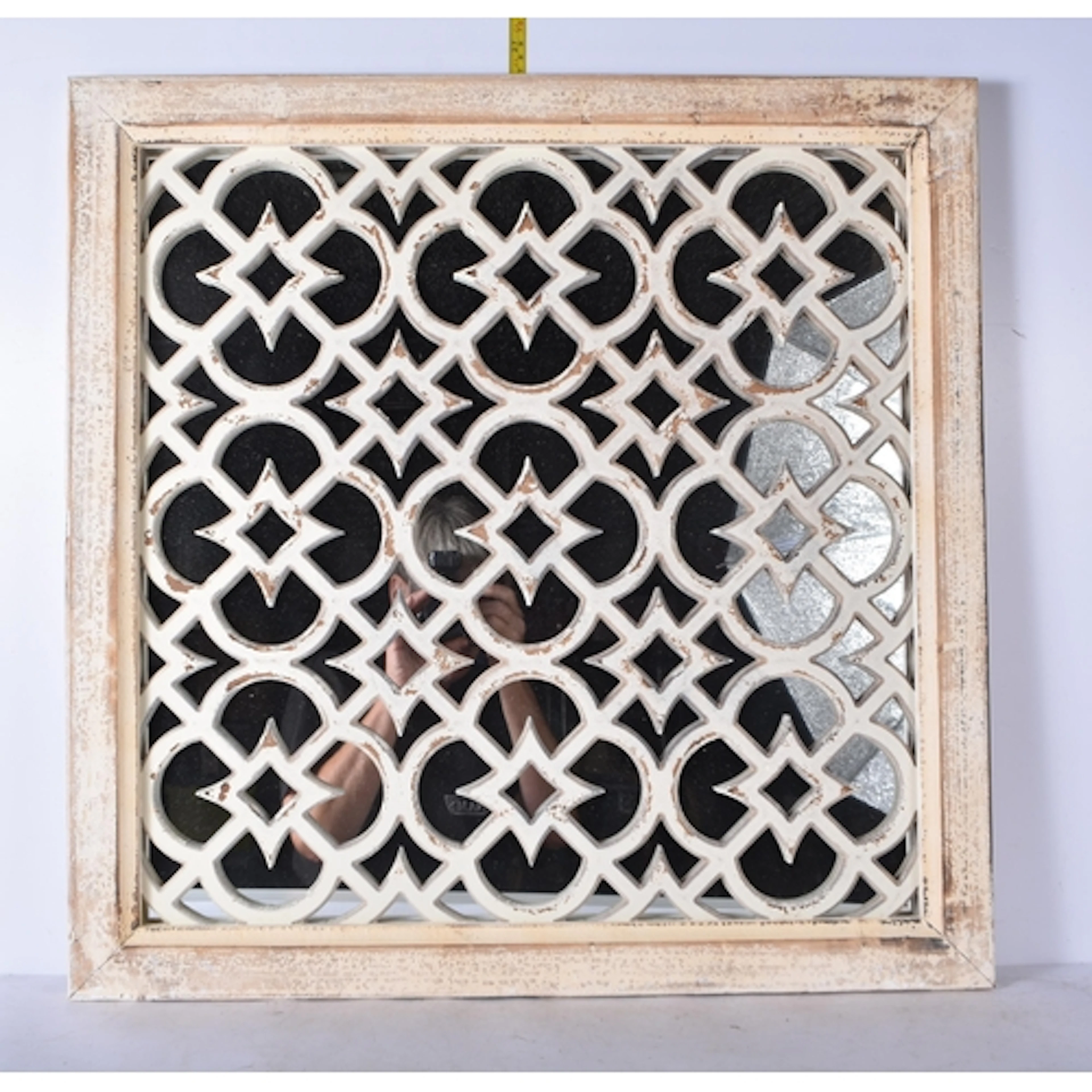 A wooden Moroccan style garden mirror 65cm x 65cm.