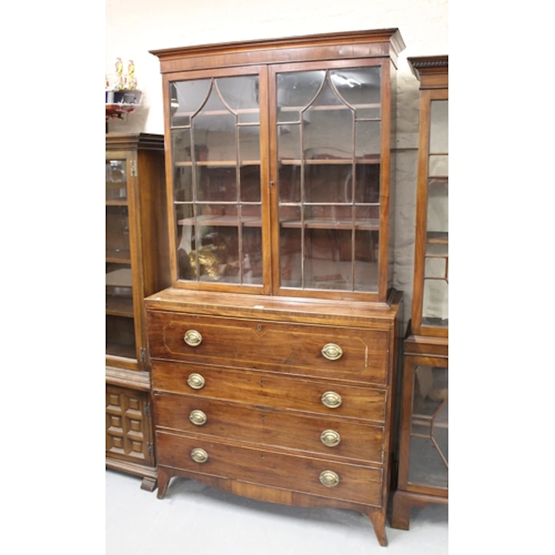 George III mahogany secretaire bookcase, the moulded cornice...