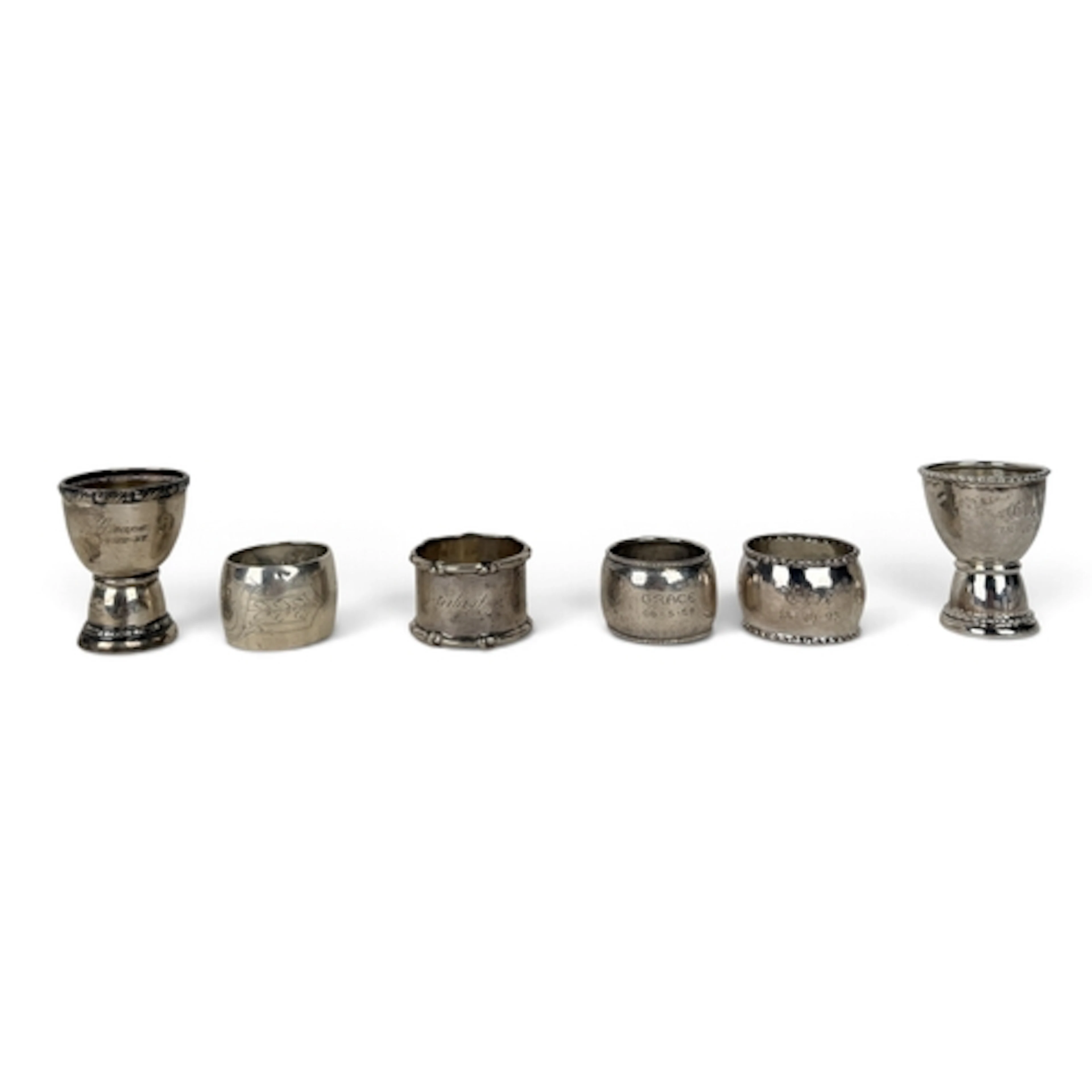 A DANISH ARTS AND CRAFTS SPOT HAMMERED SILVER EGG CUP AND NA...