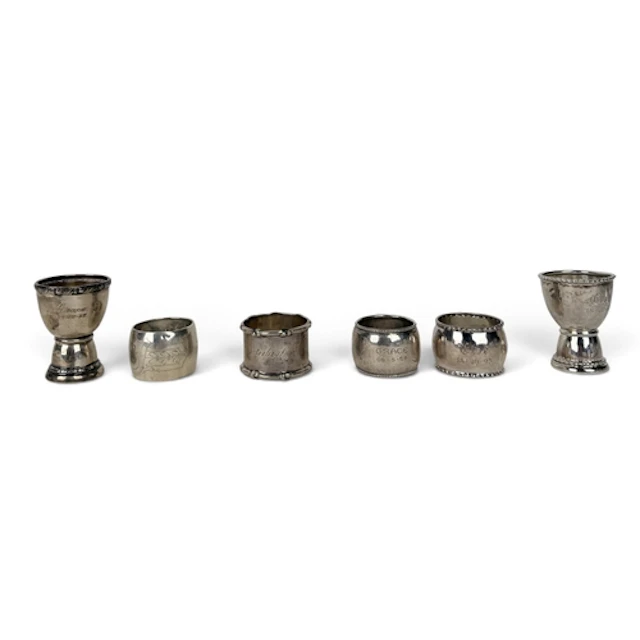 A DANISH ARTS AND CRAFTS SPOT HAMMERED SILVER EGG CUP AND NA...