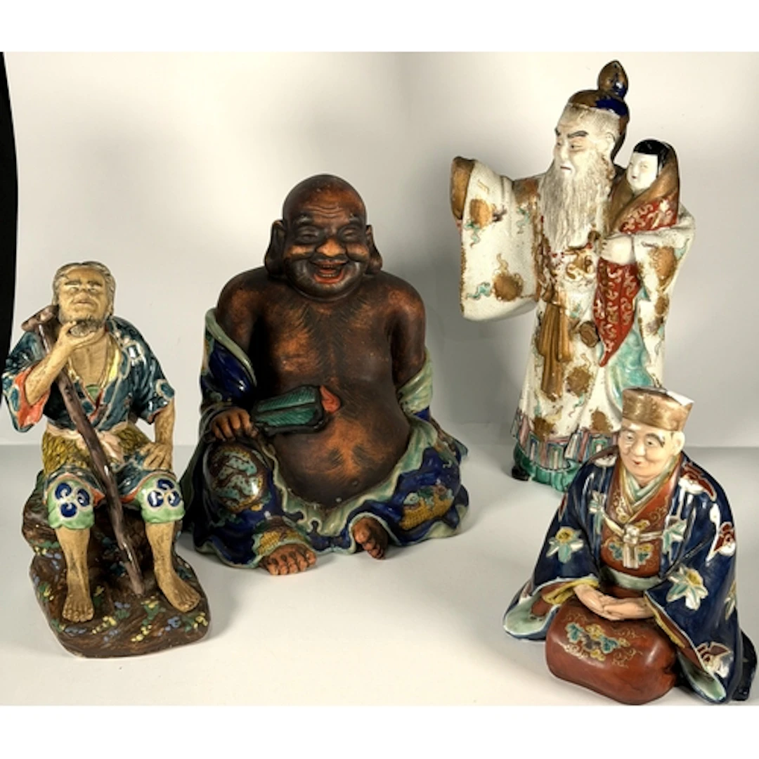 A Chinese ceramic figure of Ho Tai/Laughing Buddha with dark...