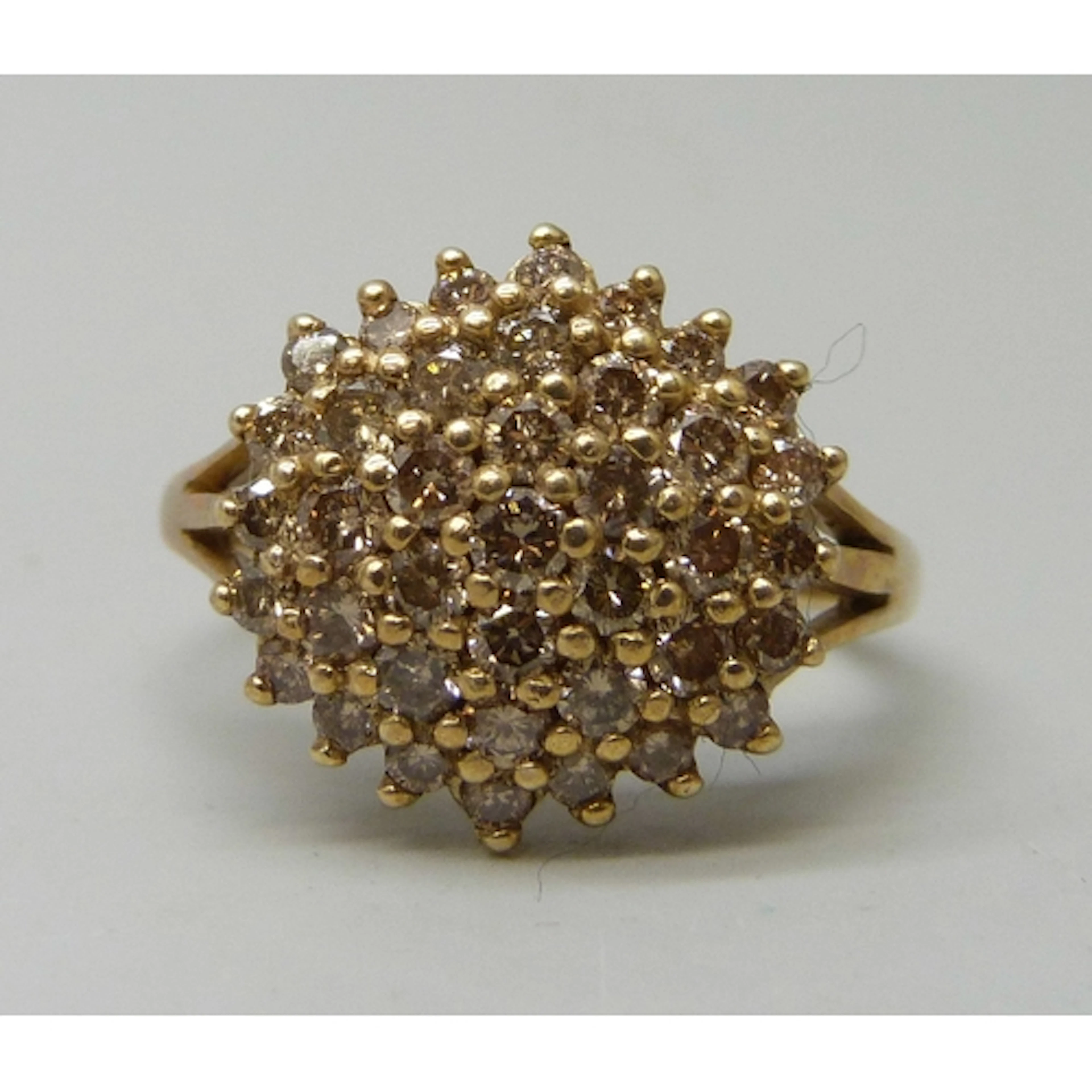 A 9ct gold diamond cluster ring, 4.6g, T