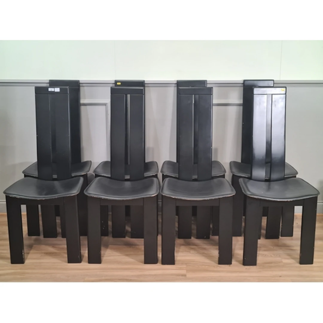 A clear glass Dining Table and eight Habitat black high back...