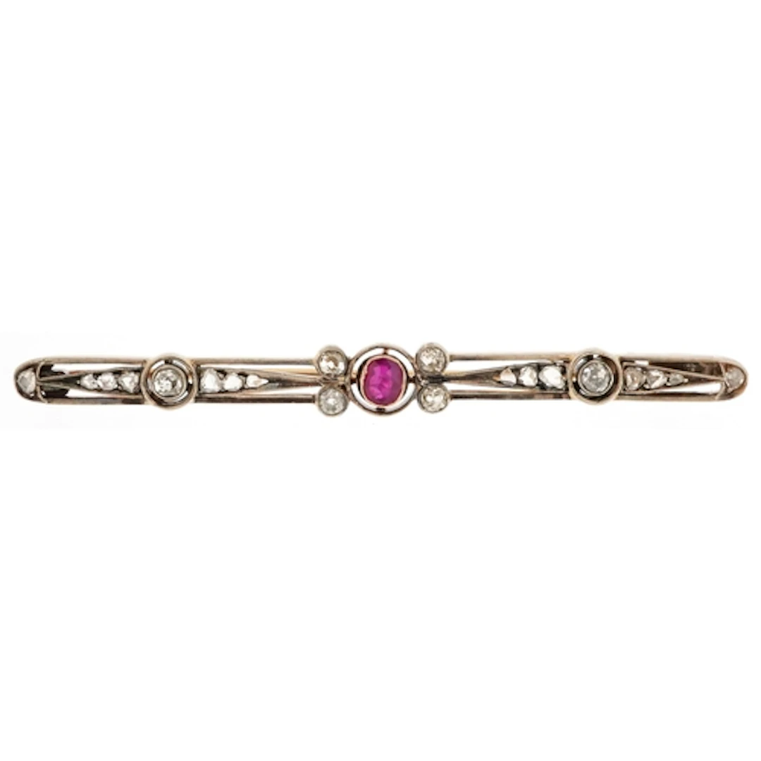 Art Deco unmarked gold bar brooch set with a ruby solitaire ...