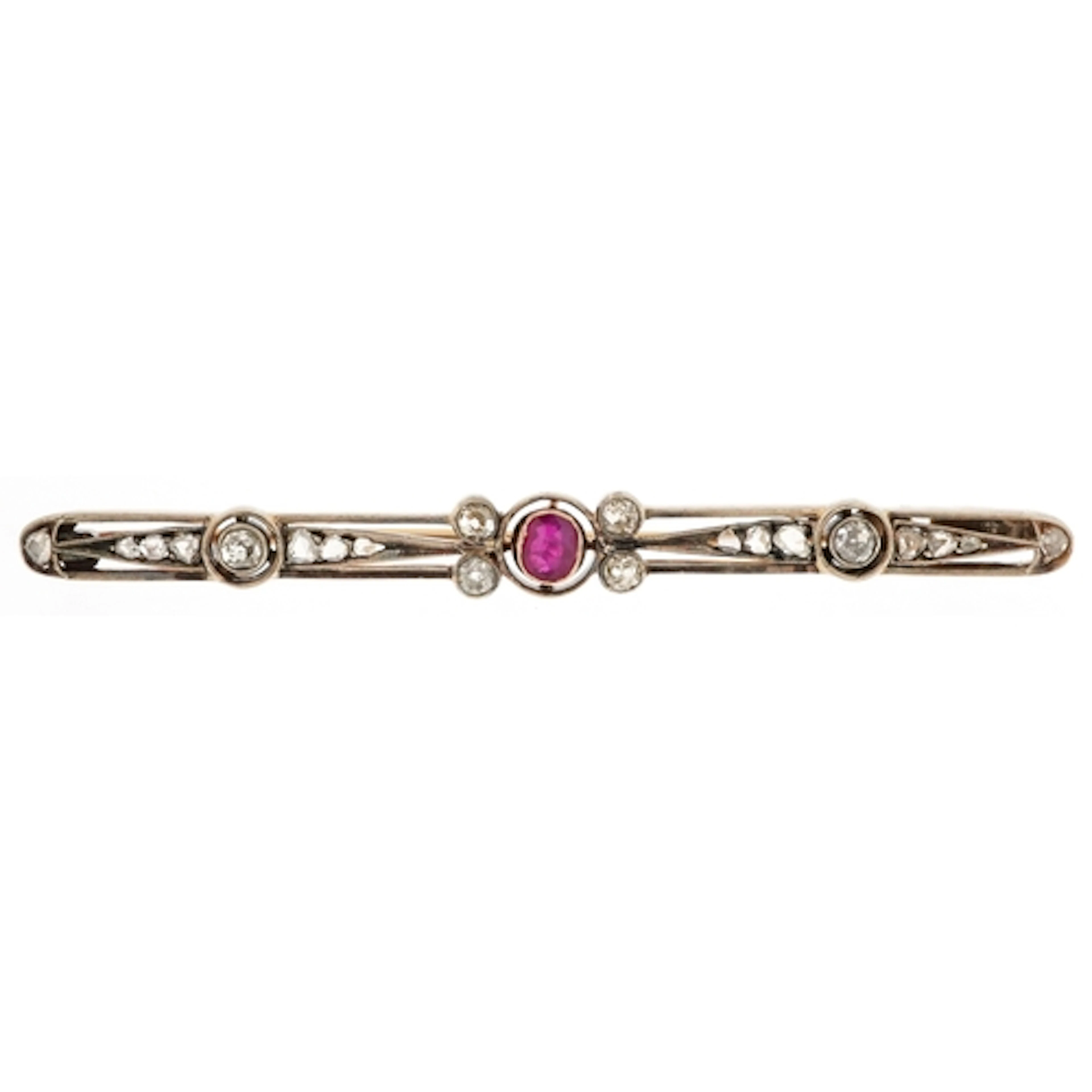 Art Deco unmarked gold bar brooch set with a ruby solitaire ...