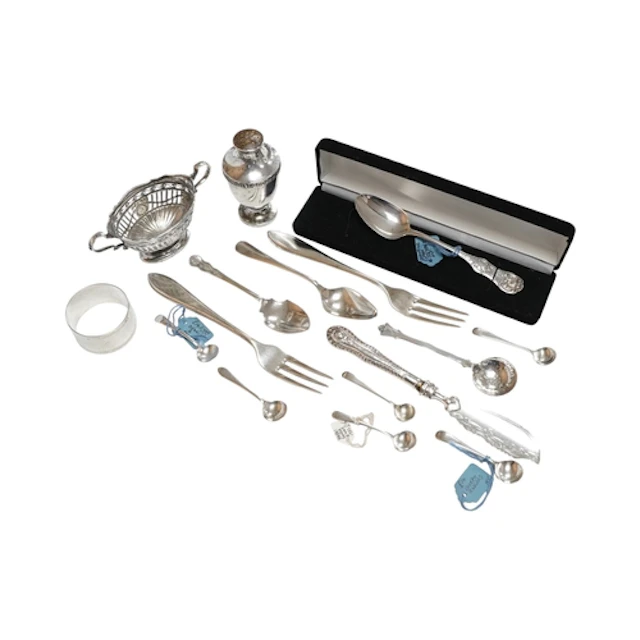A small collection of silver and white metal items, includin...