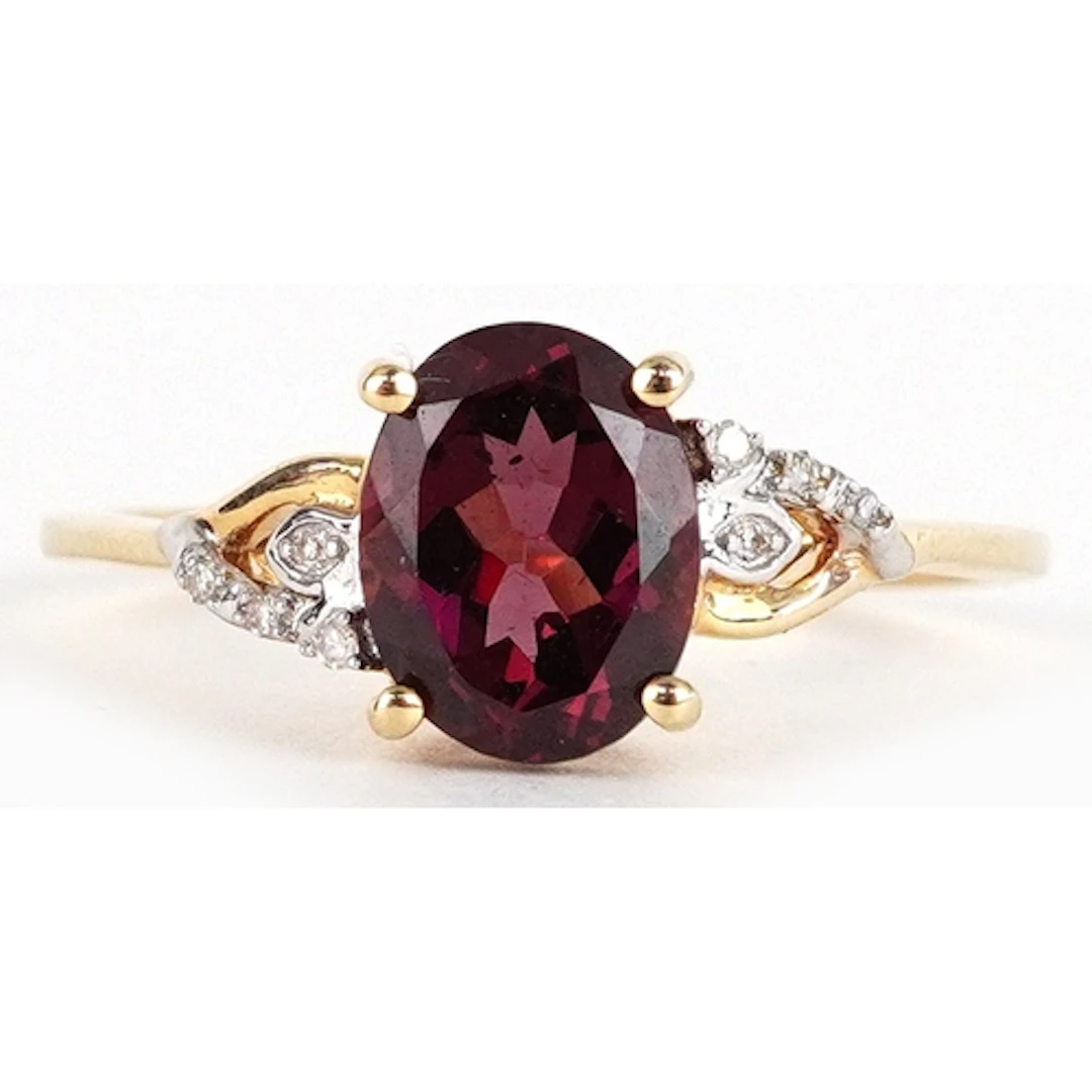 9ct gold garnet solitaire ring with diamond set shoulders, s...
