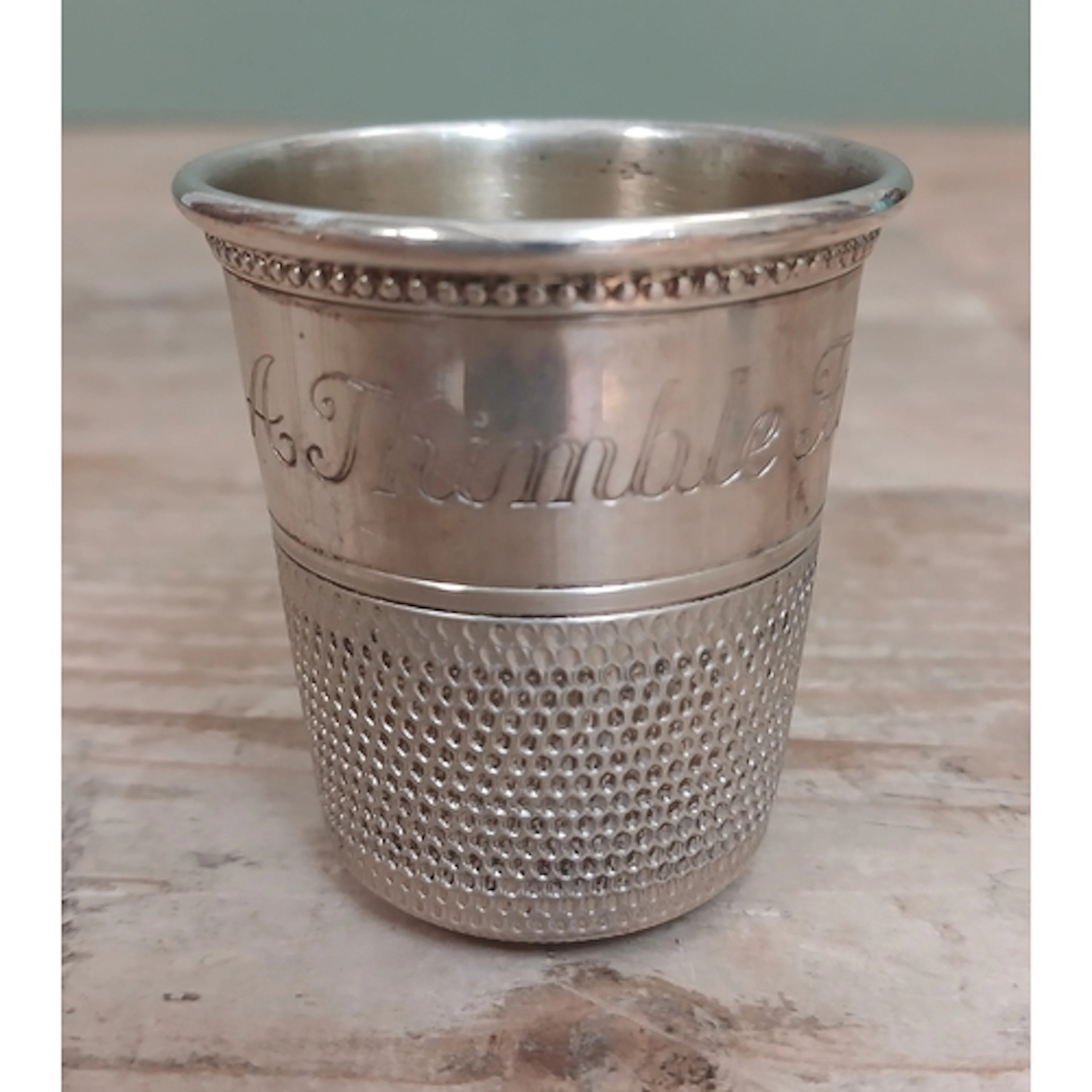 An 'Only a Thimble Full' measure, marked 'Sterling', length ...