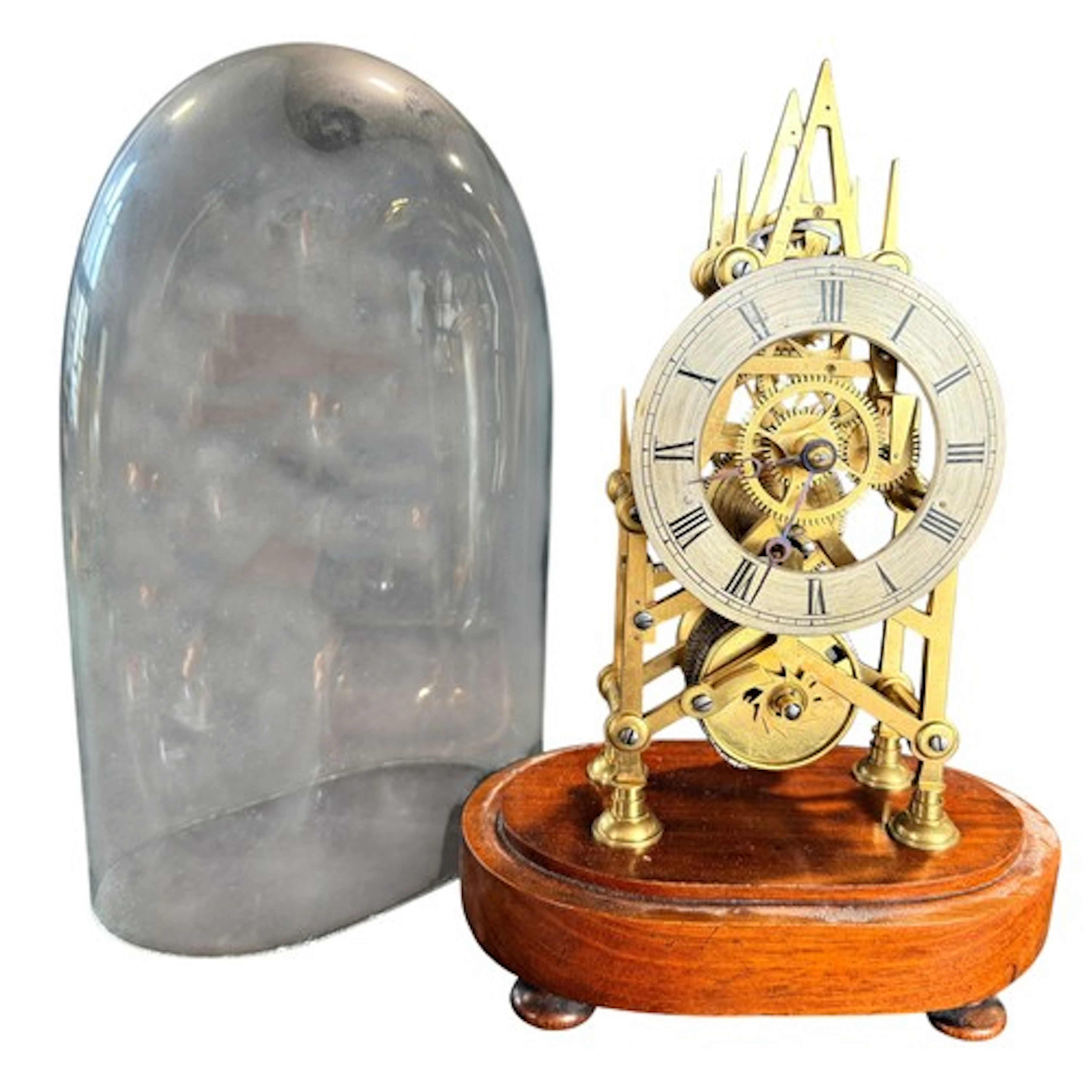 A late 19th/early 20th century brass skeleton clock under gl...