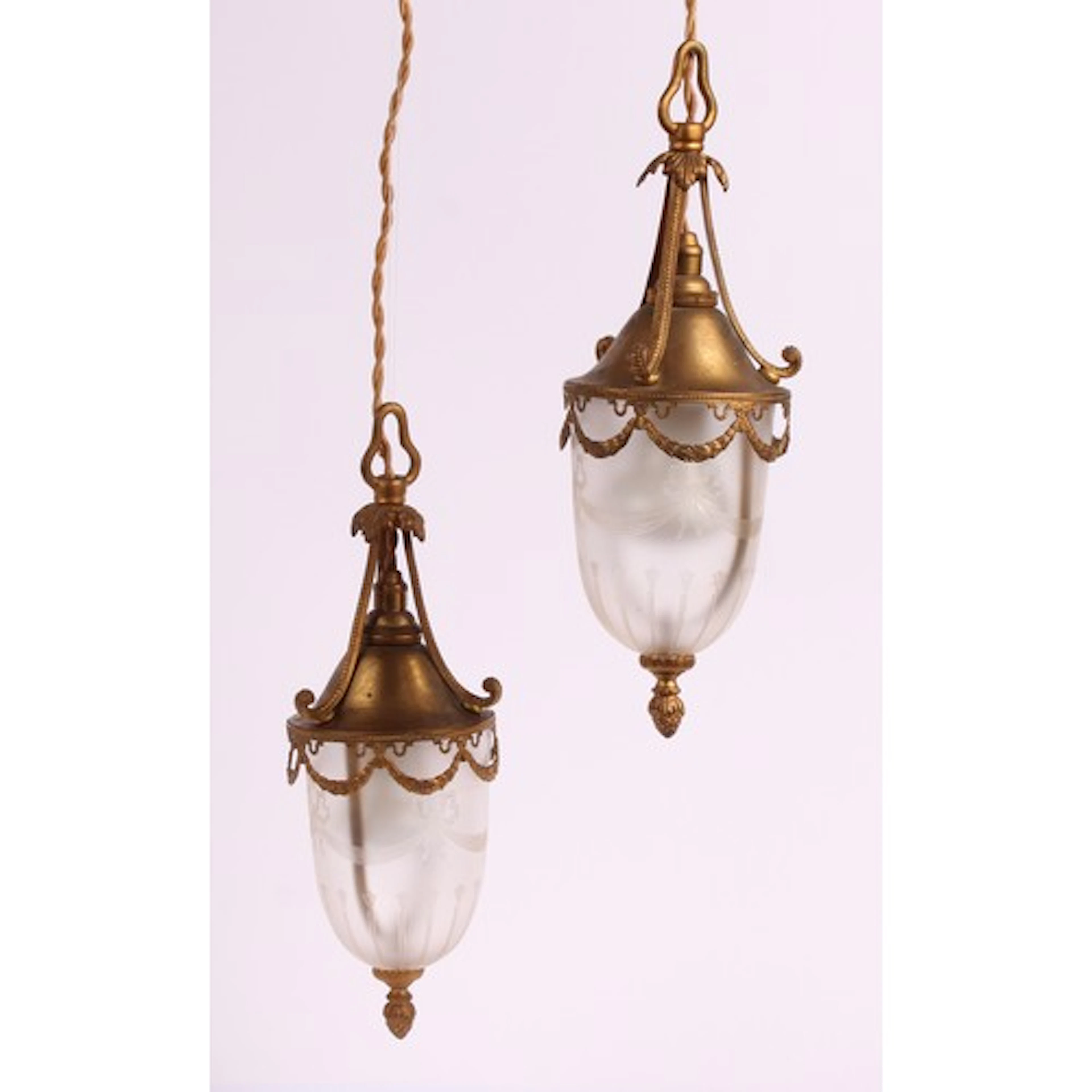 A pair of Edwardian gilt brass hall ceiling lanterns, in the...
