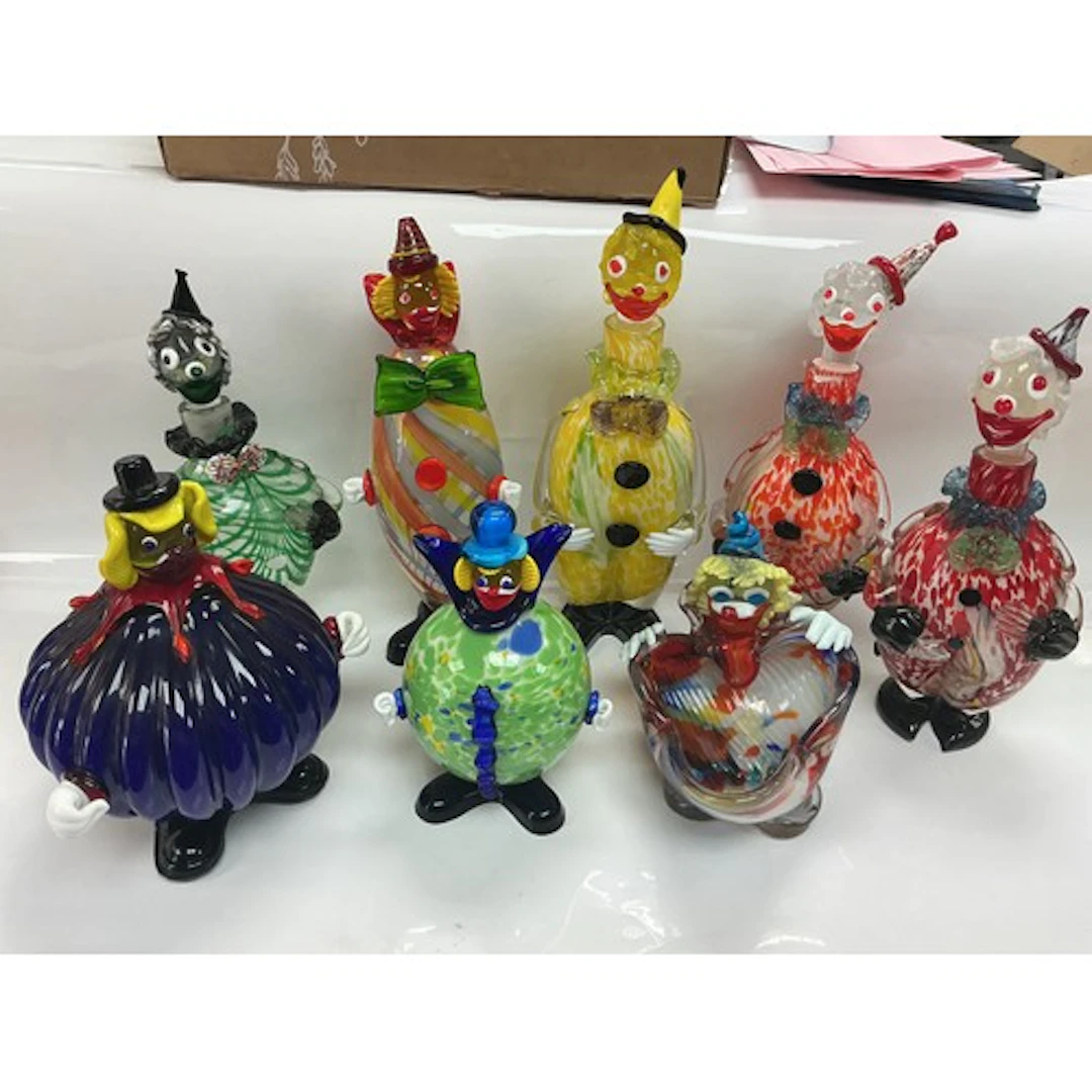 Eight Murano clown figures, decanters etc.