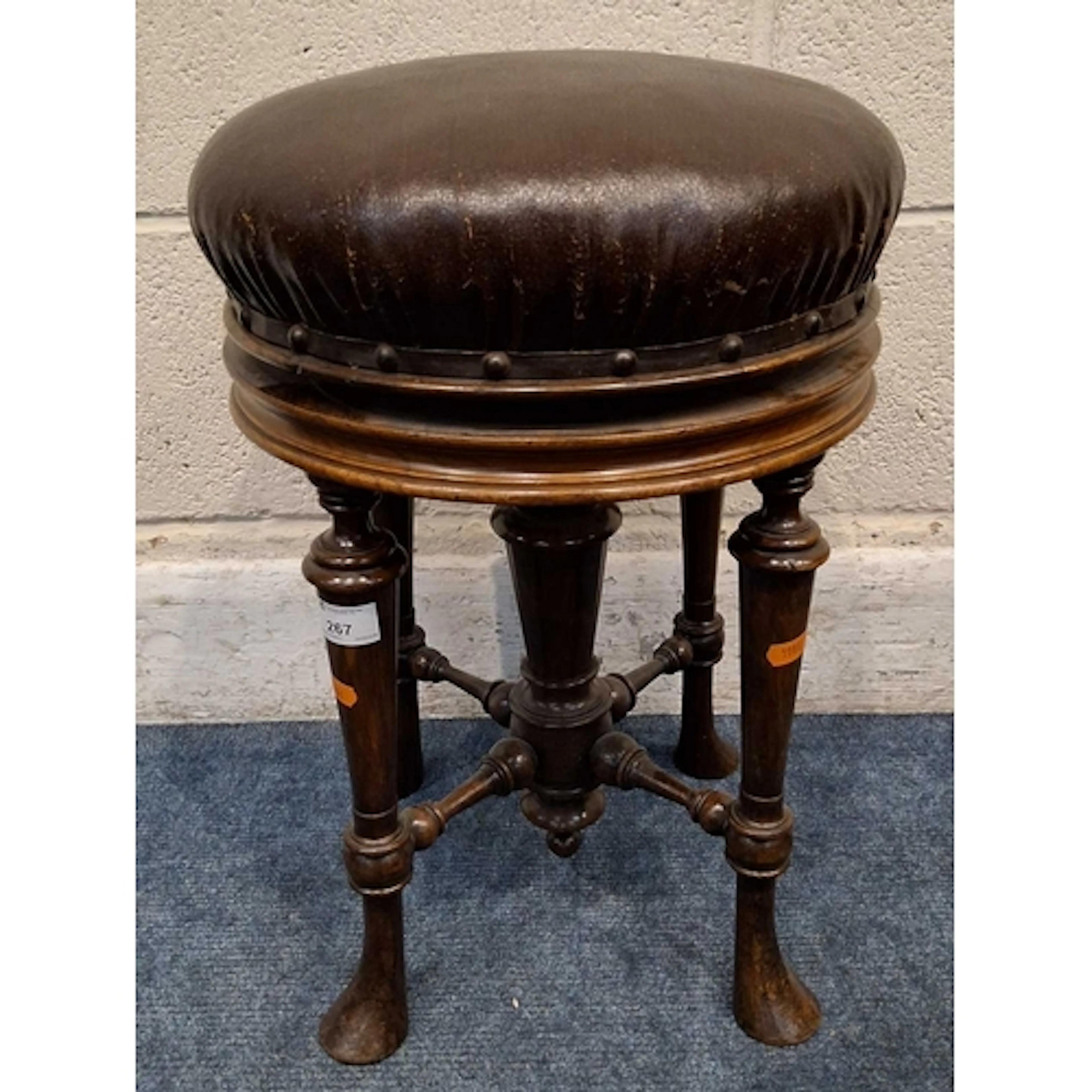 A LATE 19TH / EARLY 20TH CENTURY PIANO STOOL, with a swivel ...