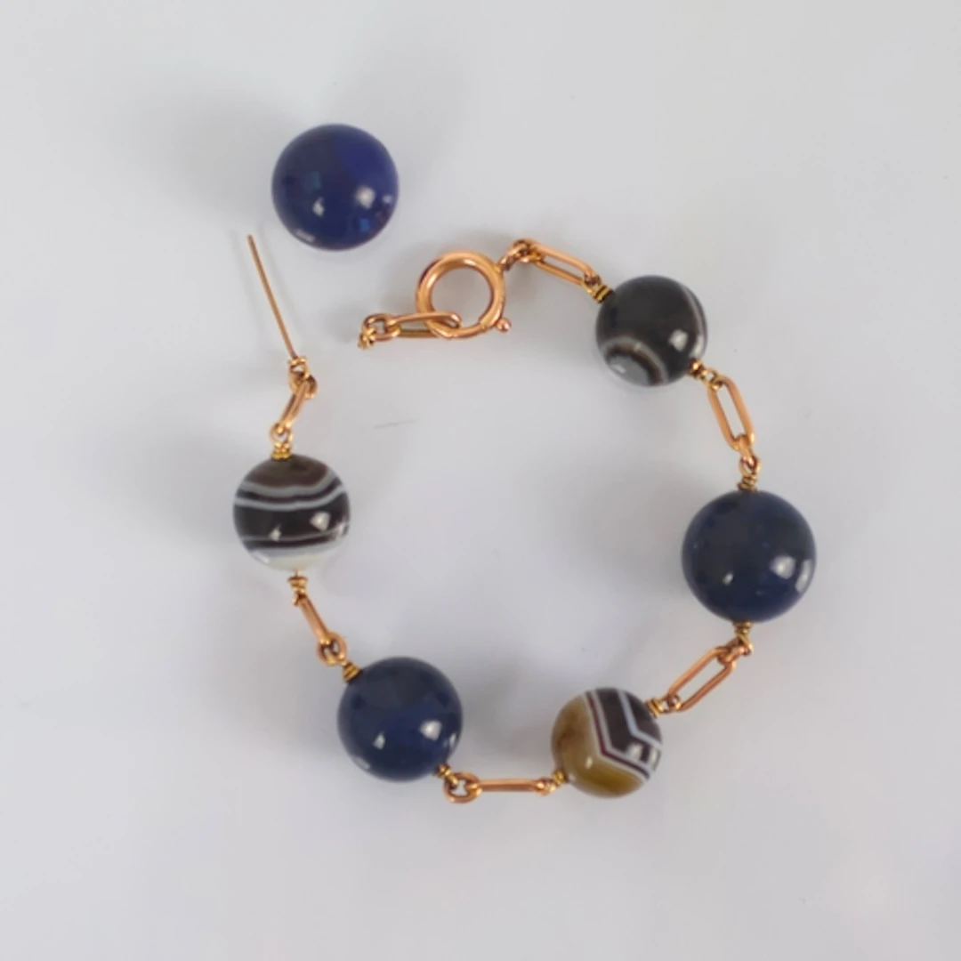 A 19th century banded agate and lapis lazuli bracelet, the p...