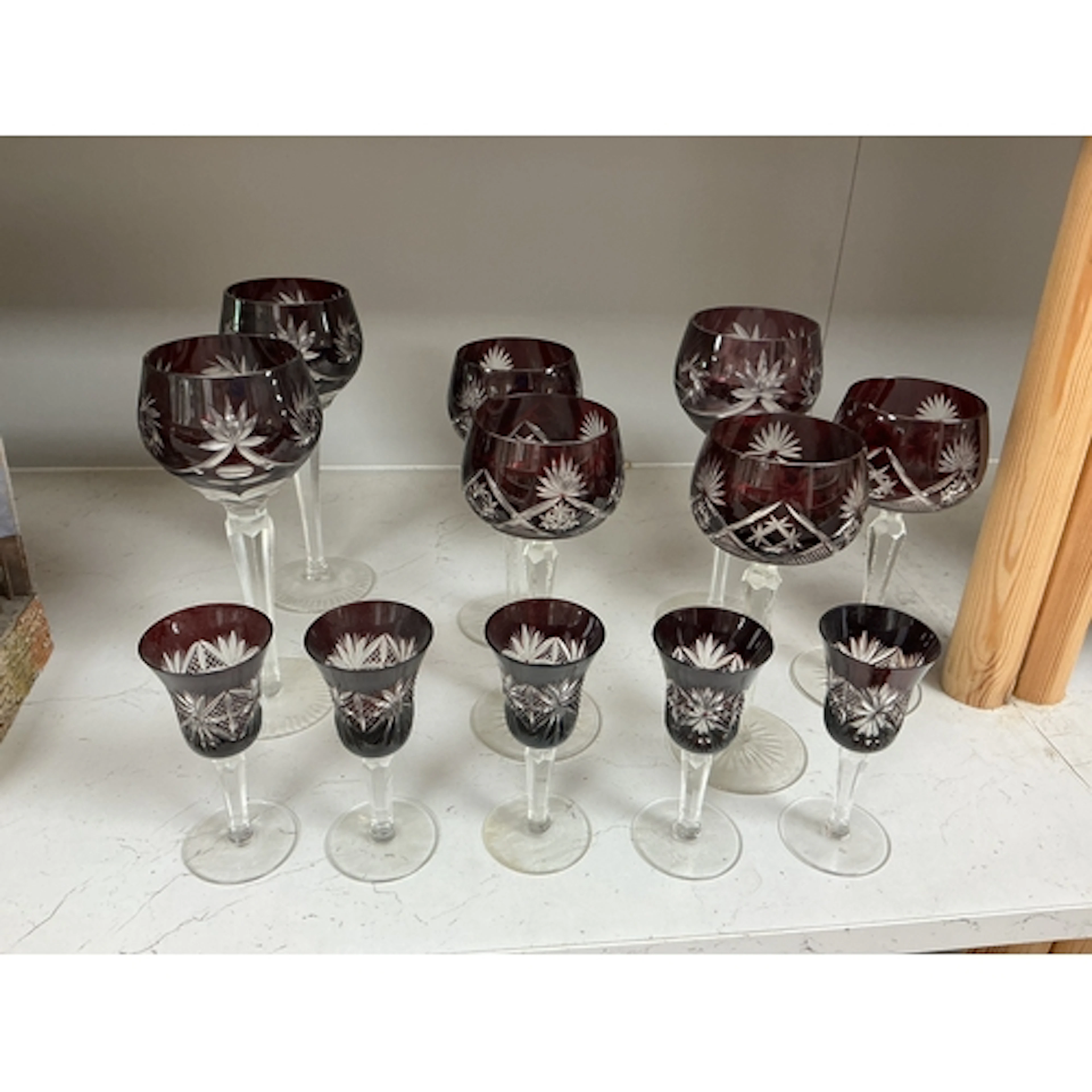 Twelve Bohemian flash cut ruby wine and liqueur glasses to i...